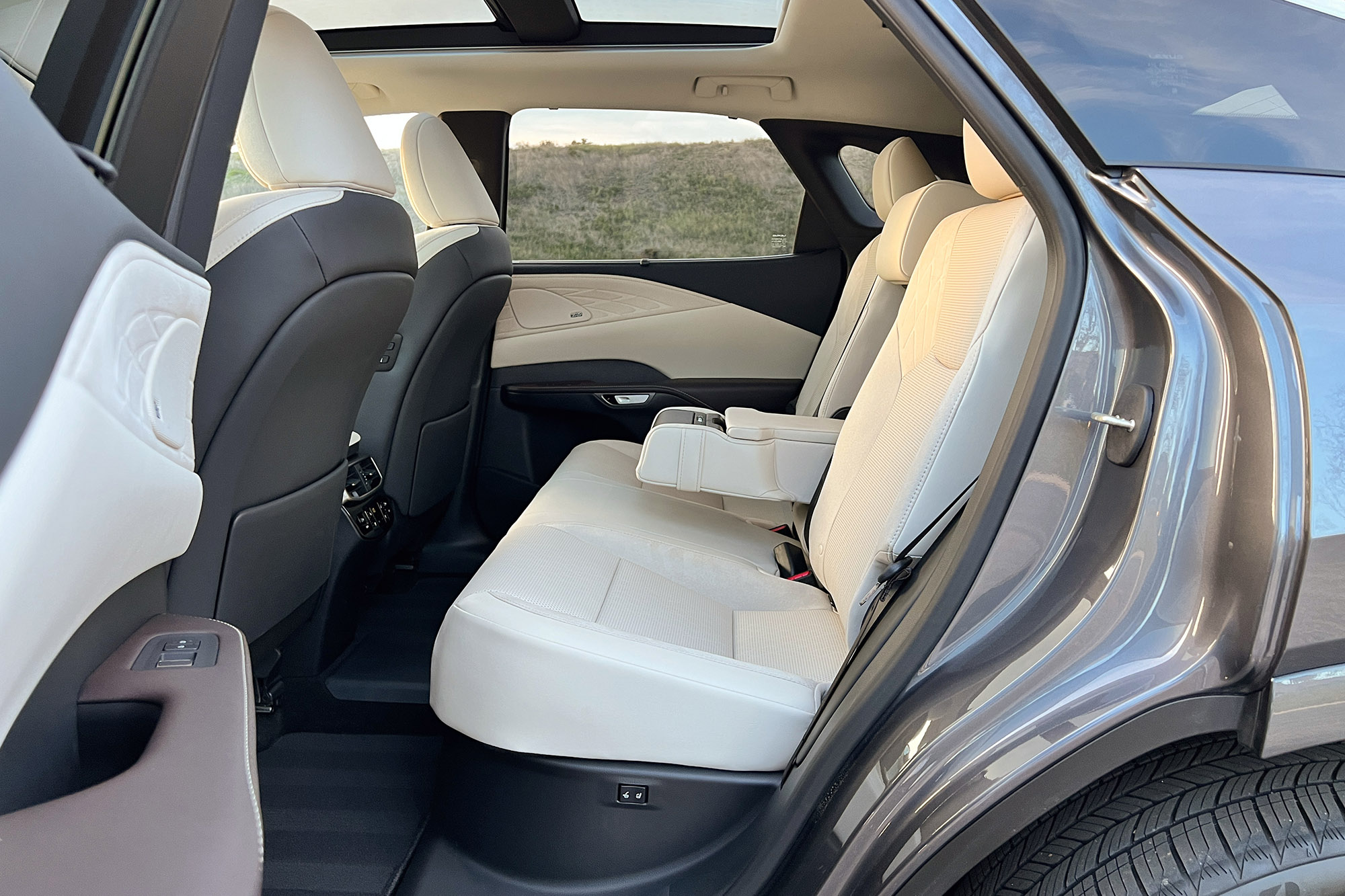 Back seat and panoramic glass sunroof in a 2024 Lexus RX 450h+ plug-in hybrid.