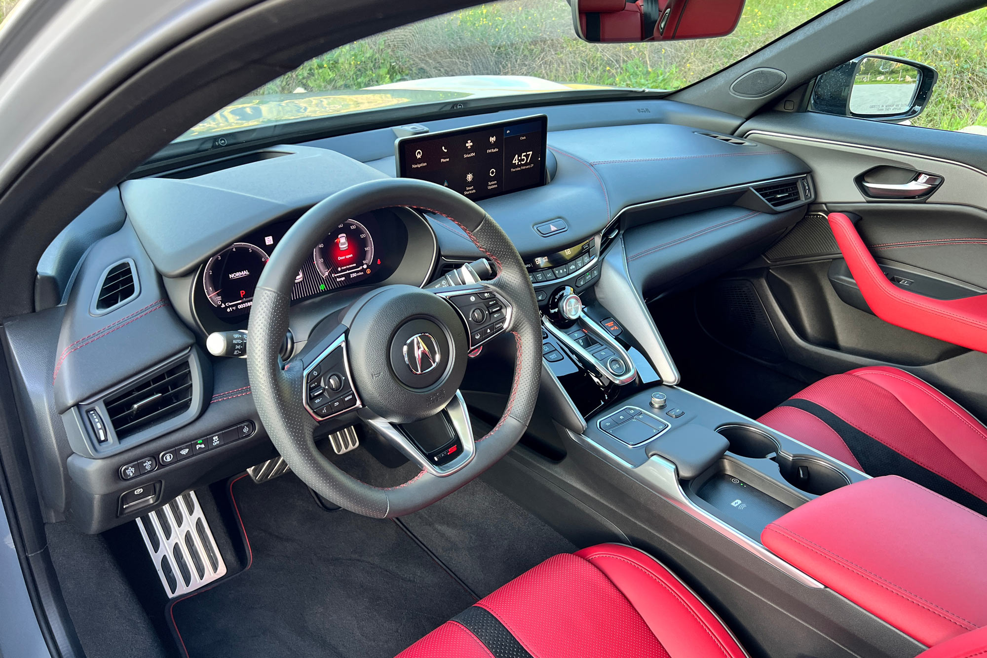 2024 Acura TLX Type S interior showing the dashboard and red leather front seats