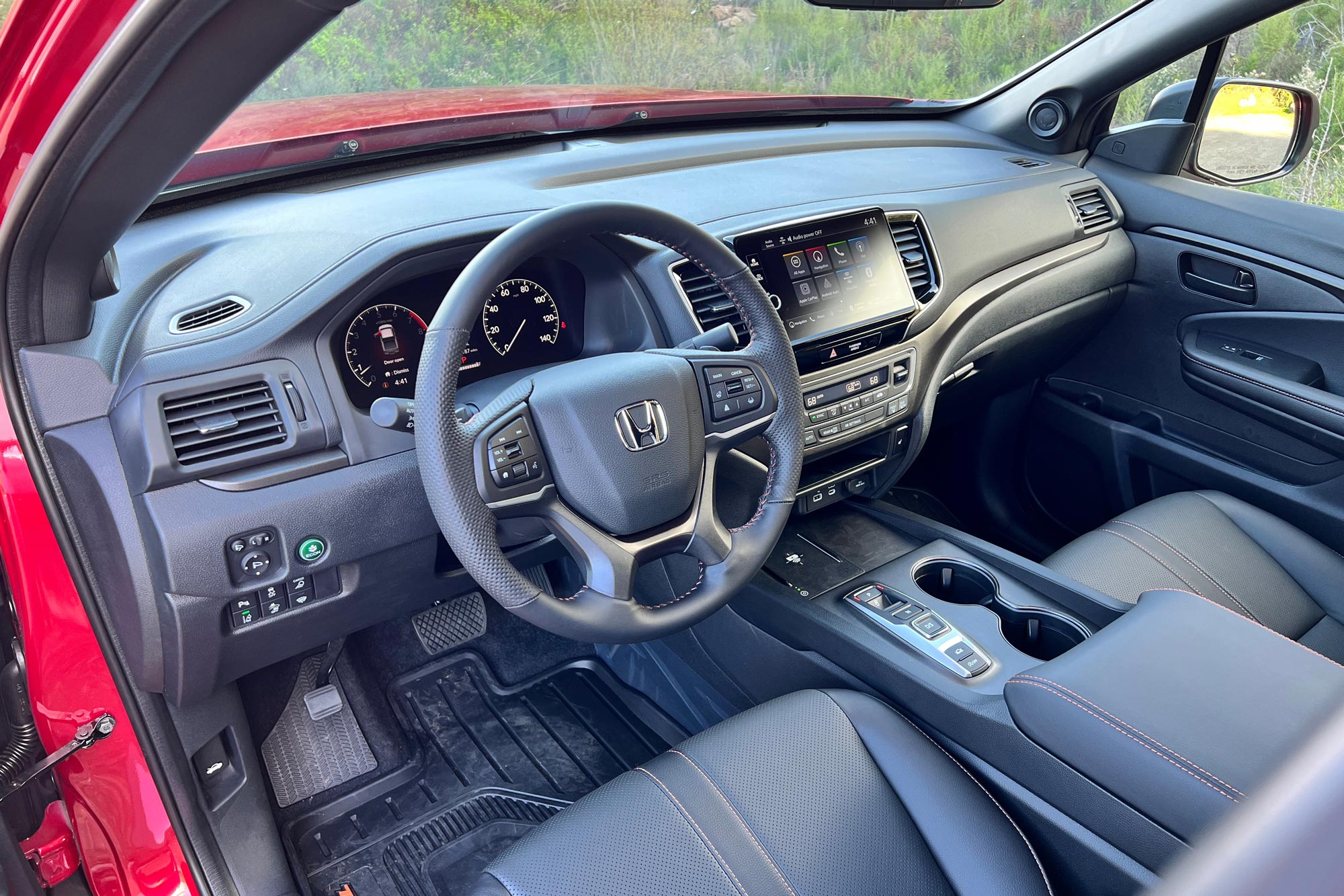  2024 Honda Ridgeline TrailSport interior dashboard and steering wheel.