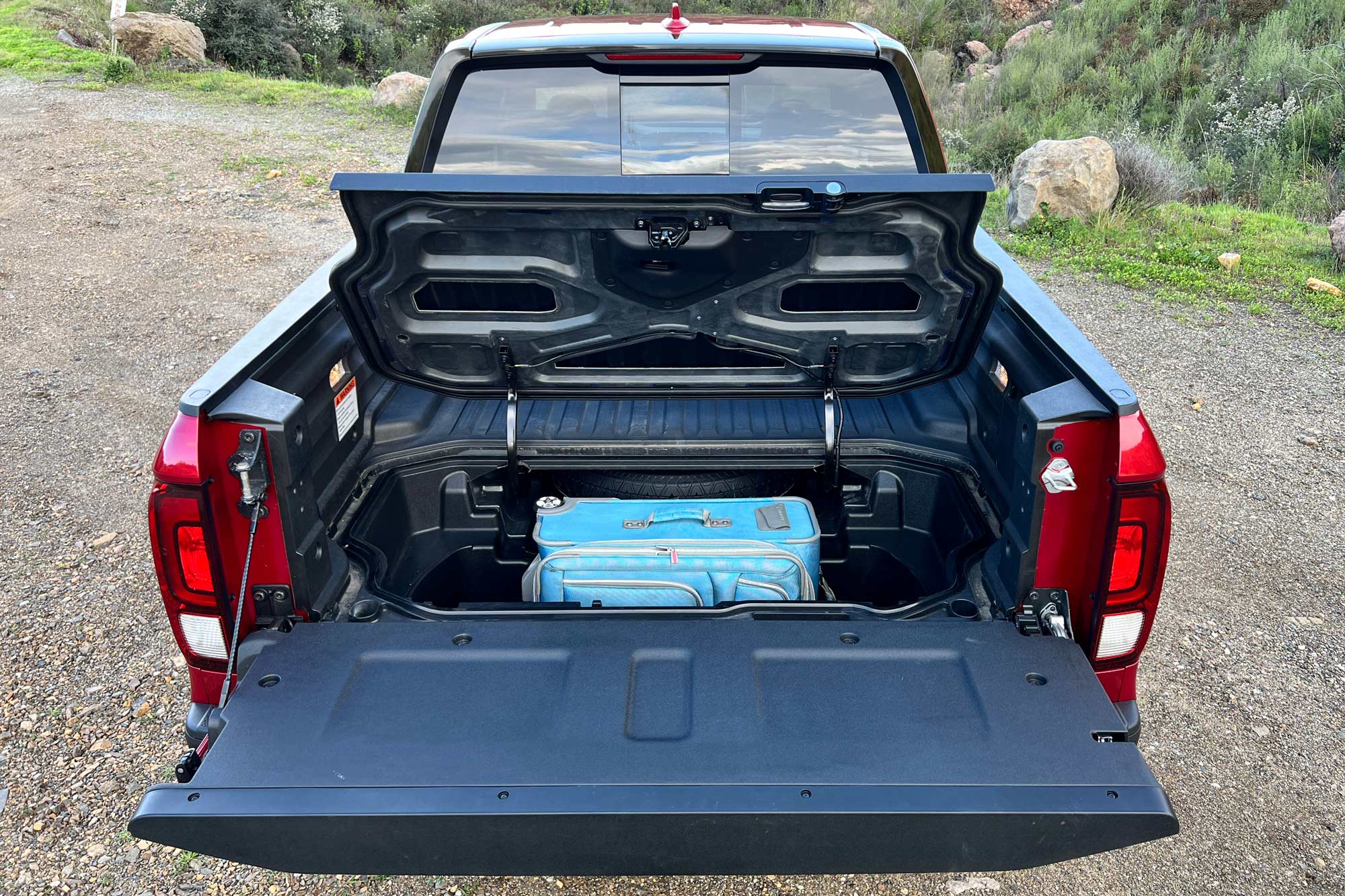 2024 Honda Ridgeline TrailSport in-bed locking trunk.
