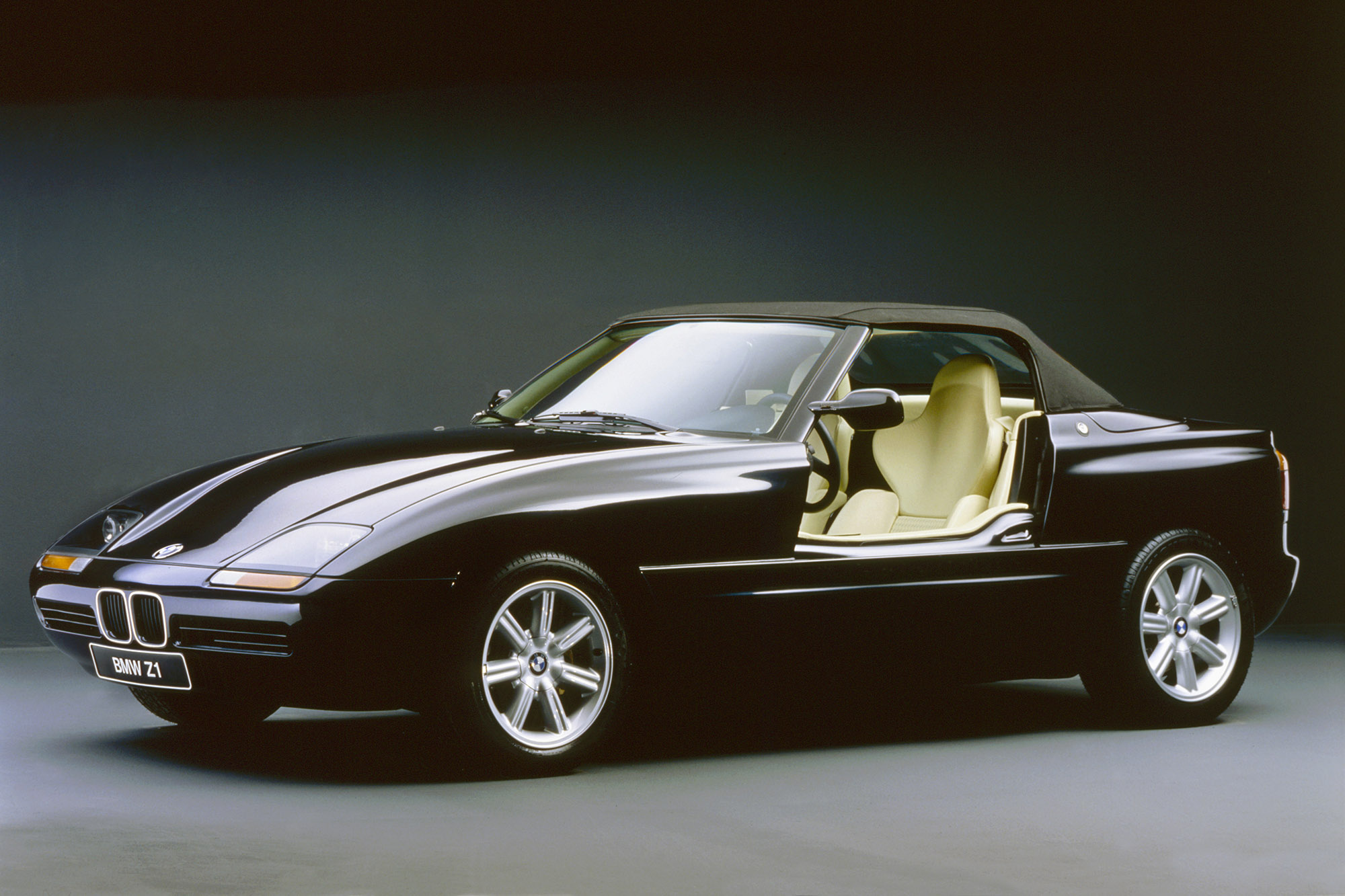 Black BMW Z1 convertible with sliding doors down.