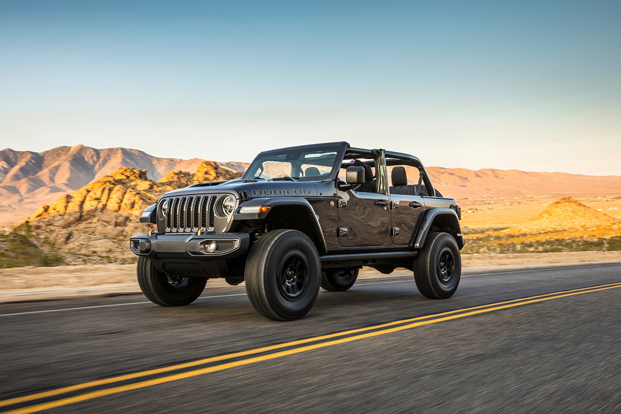 Jeep Wrangler Rubicon 392 driving down desert highway with roof off