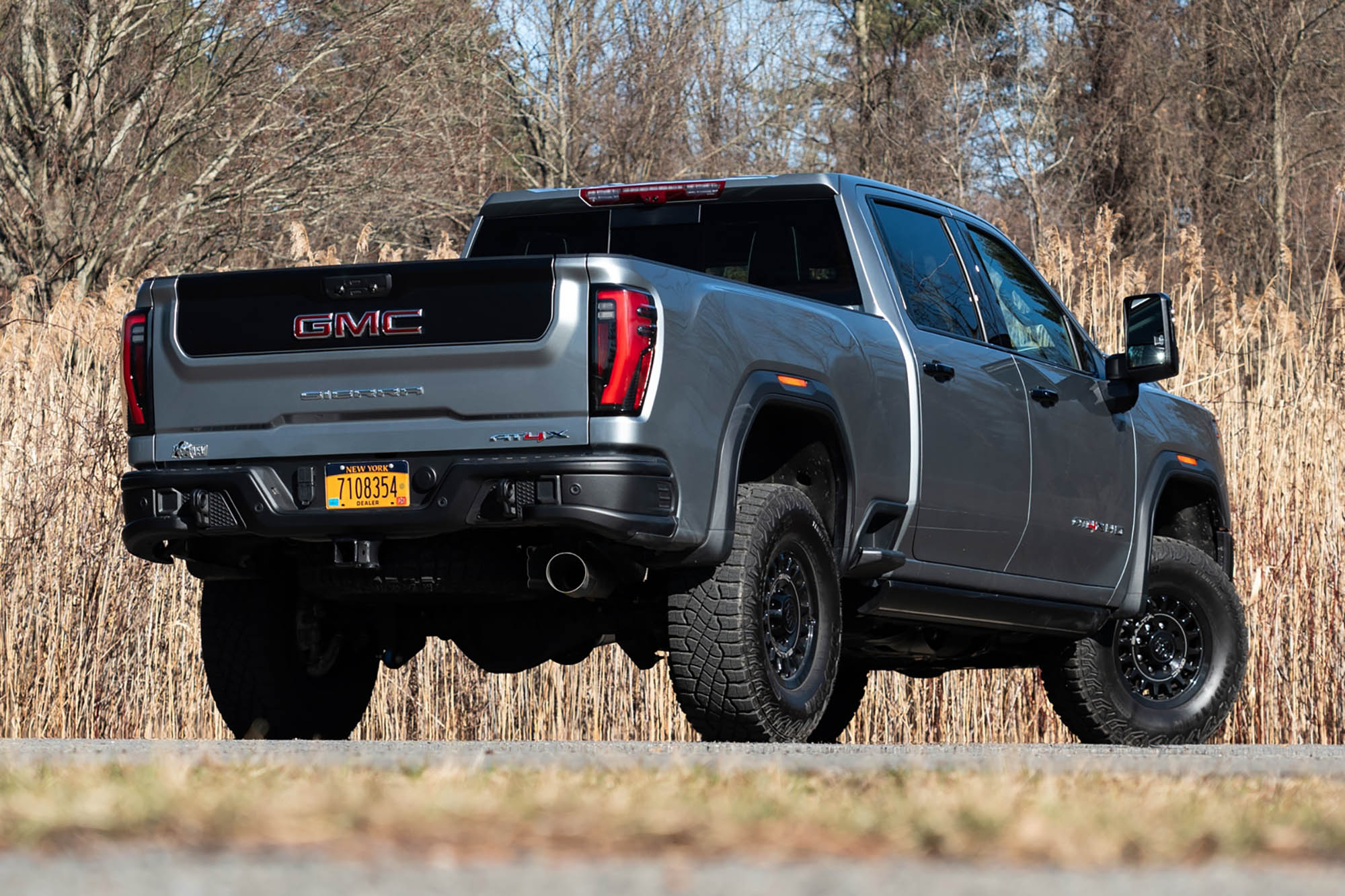 Right rear view of a gray 2024 GMC Sierra 2500HD with the AT4X AEV package