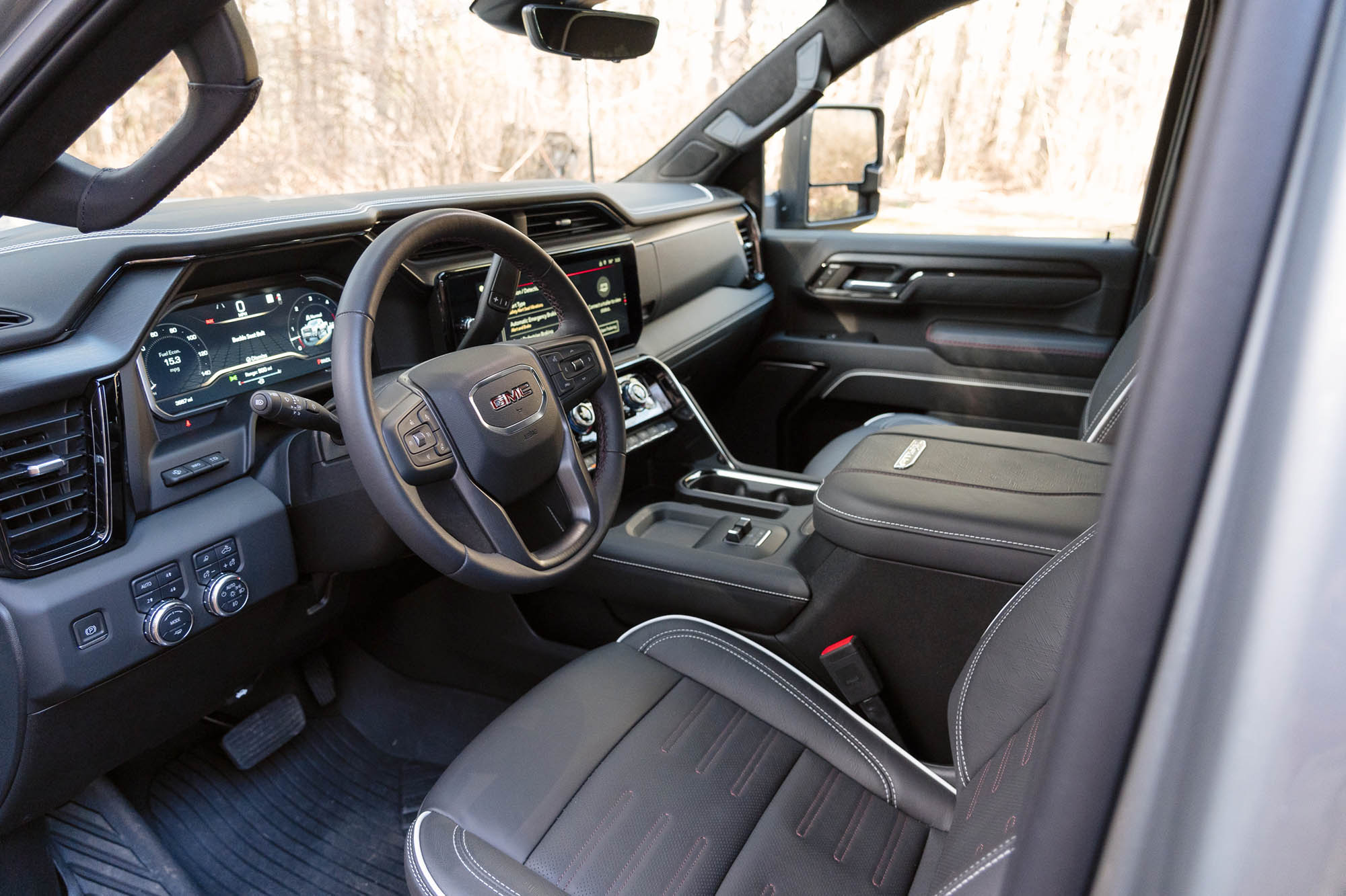 View of the 2024 GMC Sierra 2500HD AT4X AEV interior showing the dashboard and front seats