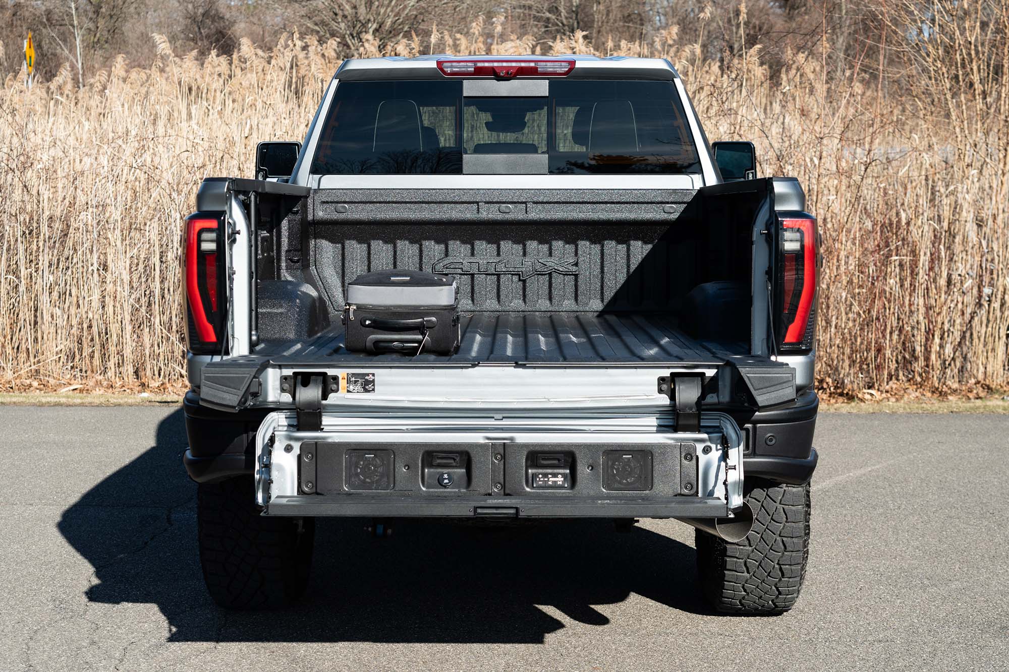 View of the 2024 GMC Sierra 2500HD AT4X AEV cargo bed showing the MultiPro tailgate.