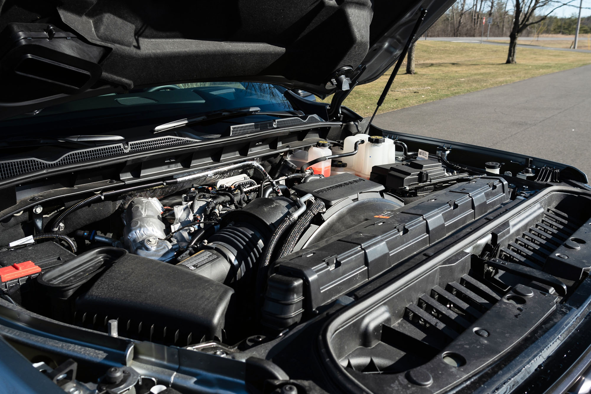 View of the Duramax turbo-diesel 6.6-liter V8 engine in a 2024 GMC Sierra 2500HD AT4X AEV.