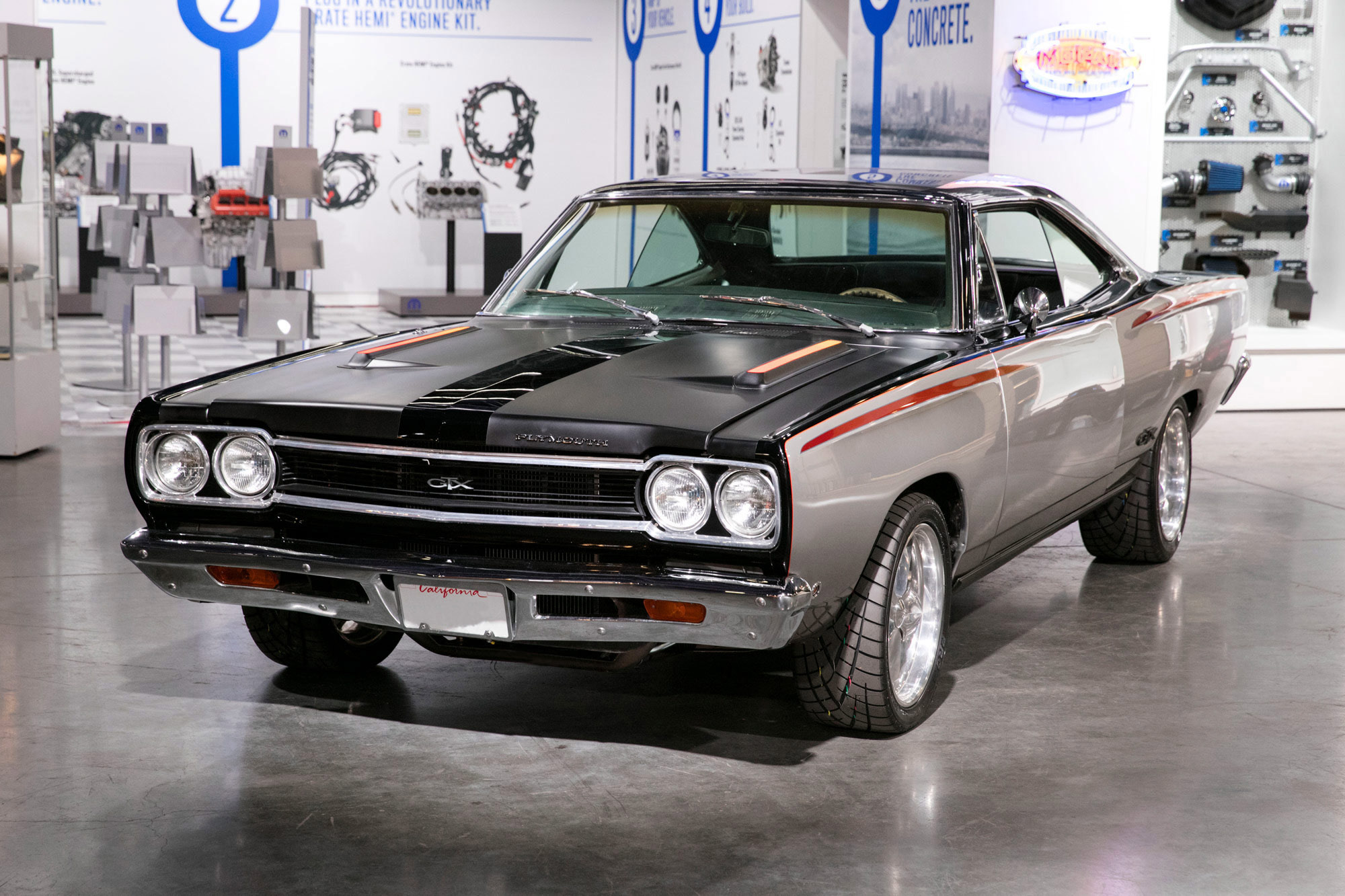 1968 Plymouth GTX classic muscle car parked in showroom