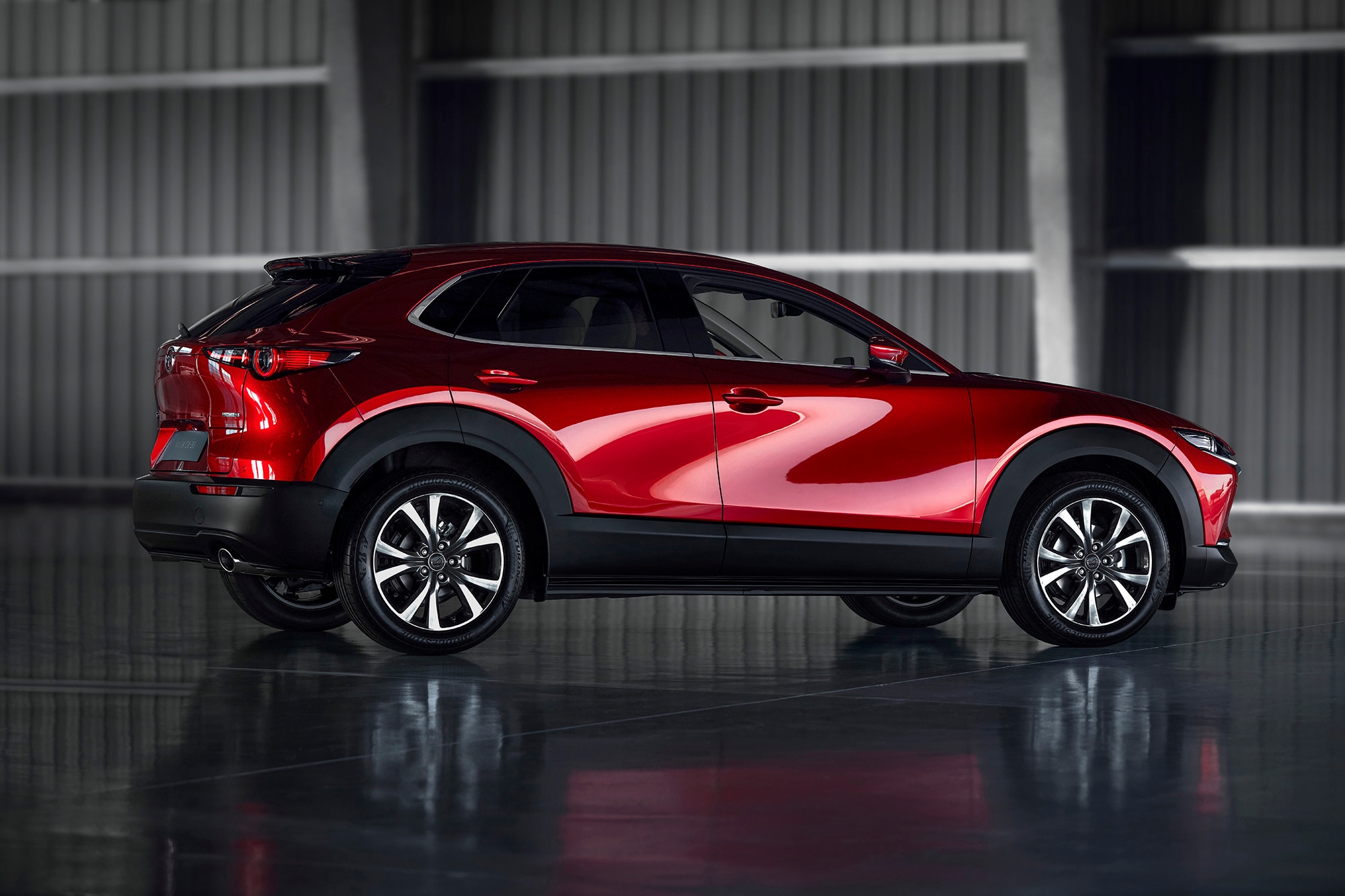 2023 Mazda CX-30 in red, side-rear view
