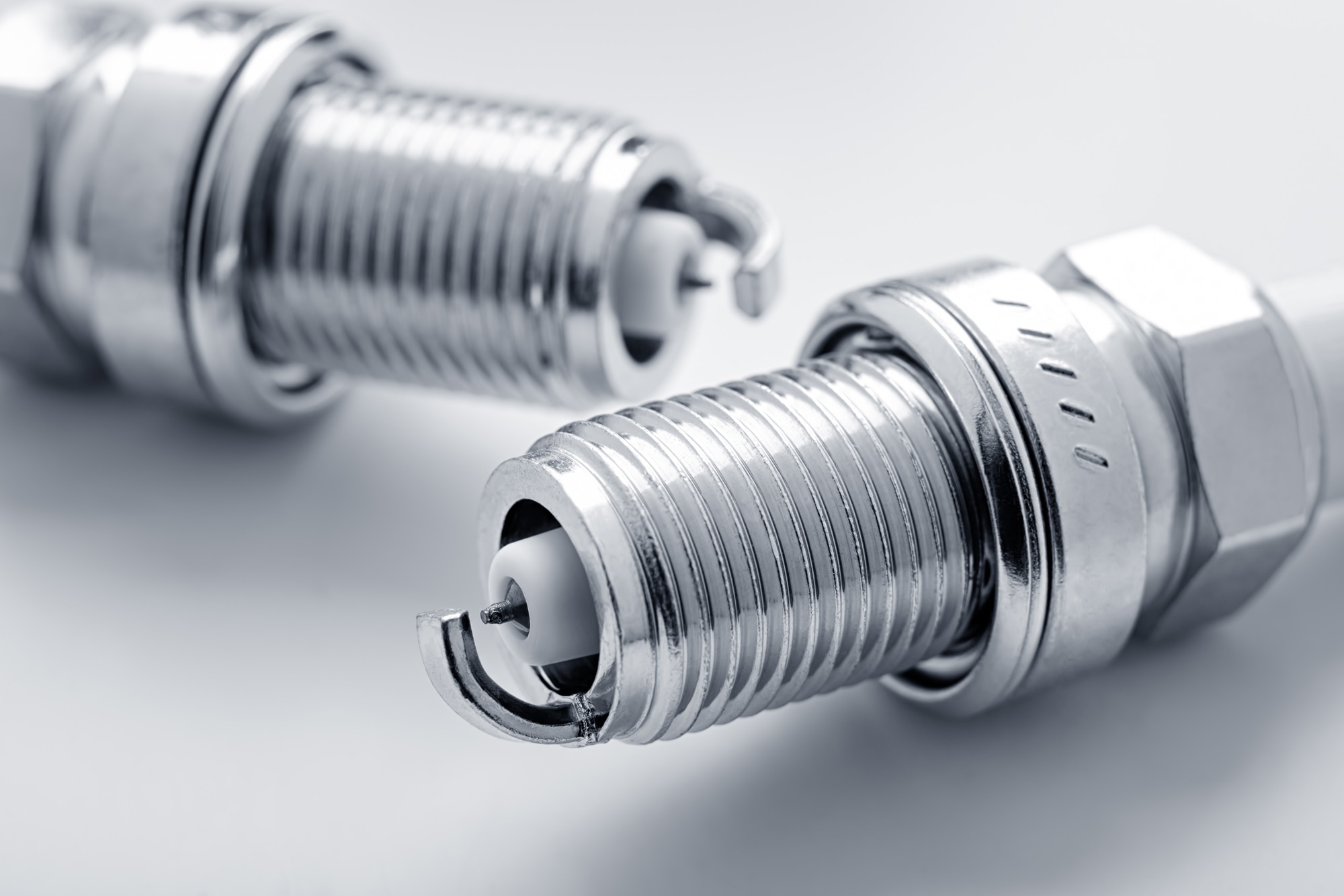 Close-up of two new spark plugs.