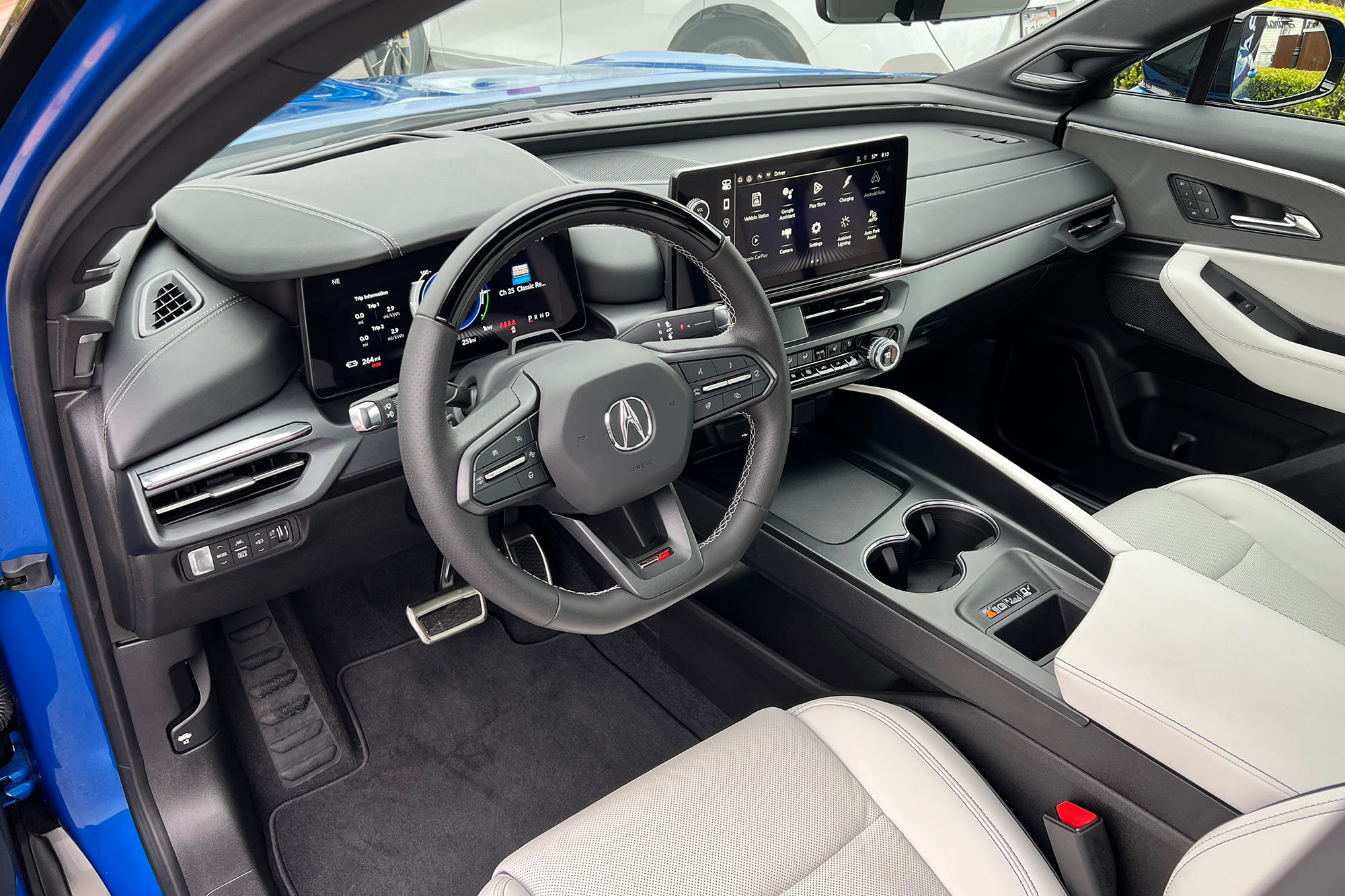 View of the dashboard, center console, and Orchid leather front seats in the 2024 Acura ZDX Type S.