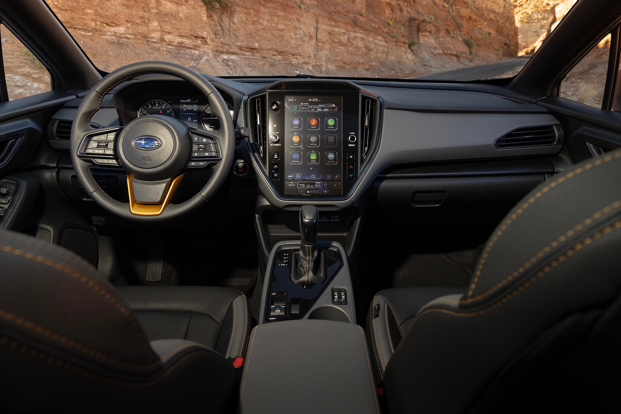 The front seats and dashboard of a 2024 Subaru Crosstrek Wilderness with a StarTex interior