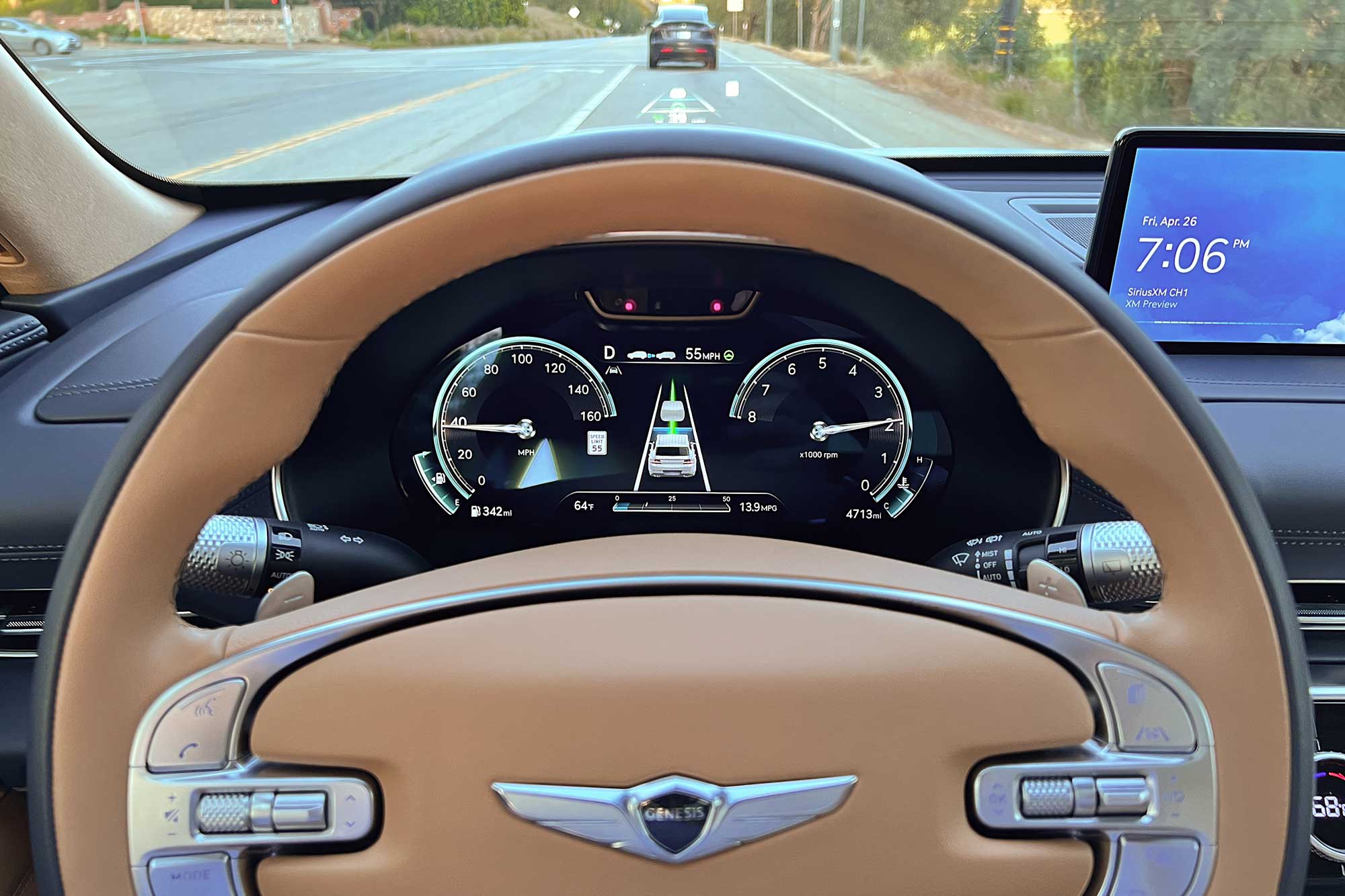 View of the 2024 Genesis GV80 3.5T Prestige Signature interior showing the Highway Driving Assist technology active.