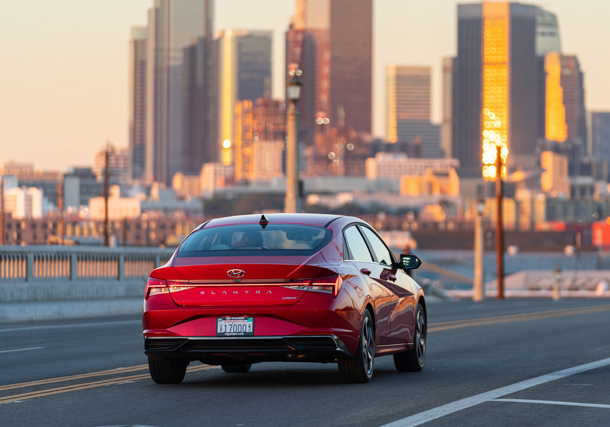 2023 Hyundai Elantra Limited in red driving toward Downtown Los Angeles
