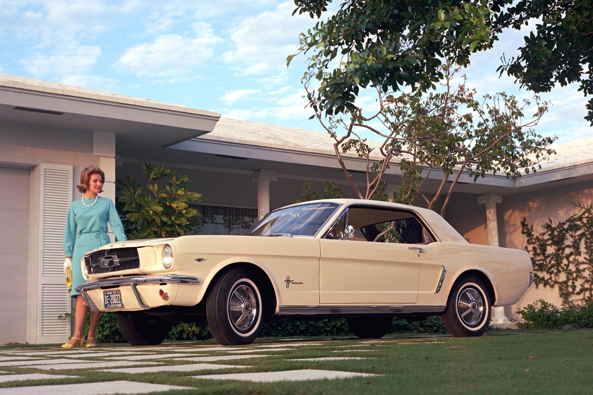A white 1965 Ford Mustang