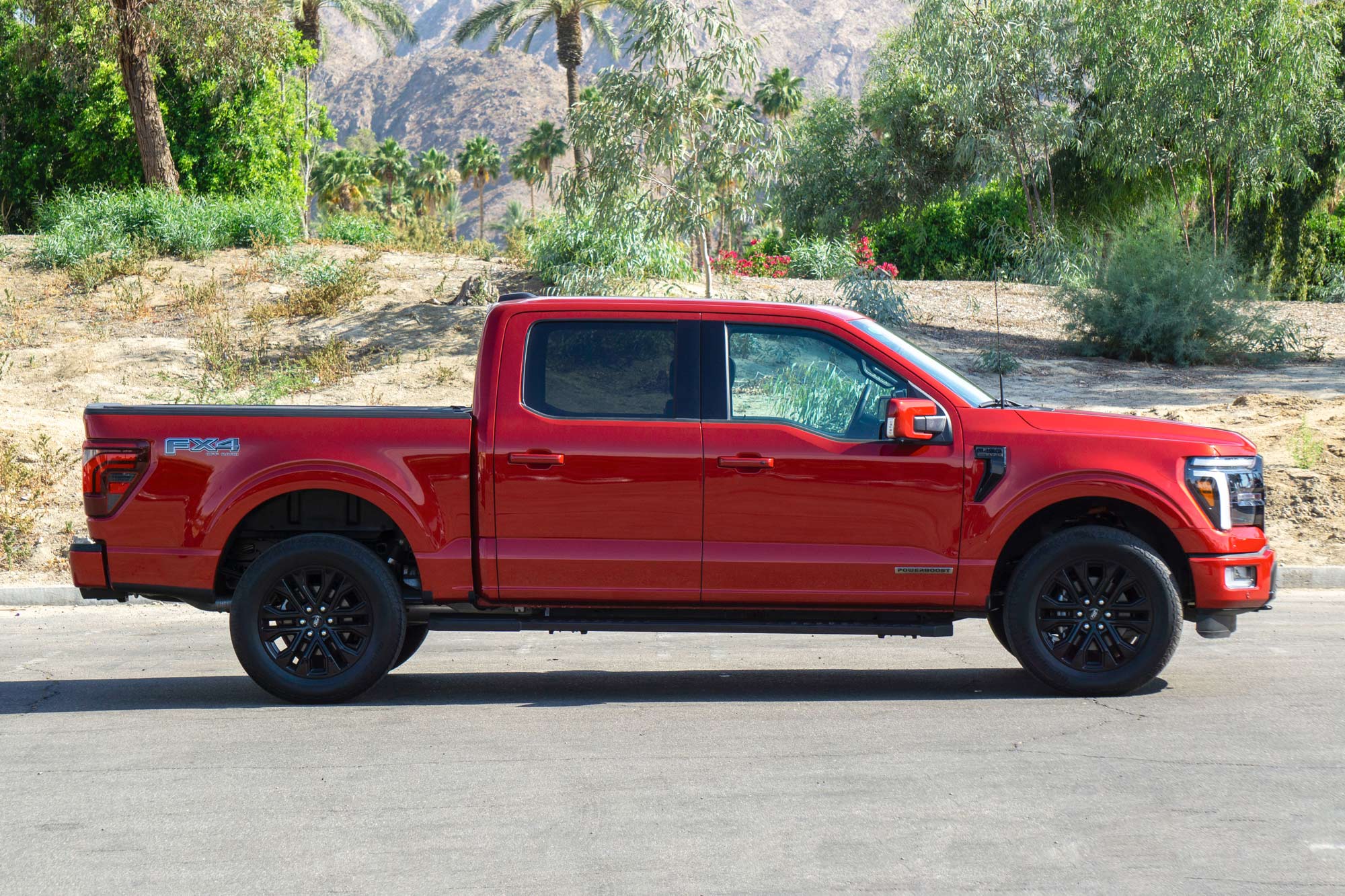 Side of a red 2024 Ford F-150 Lariat