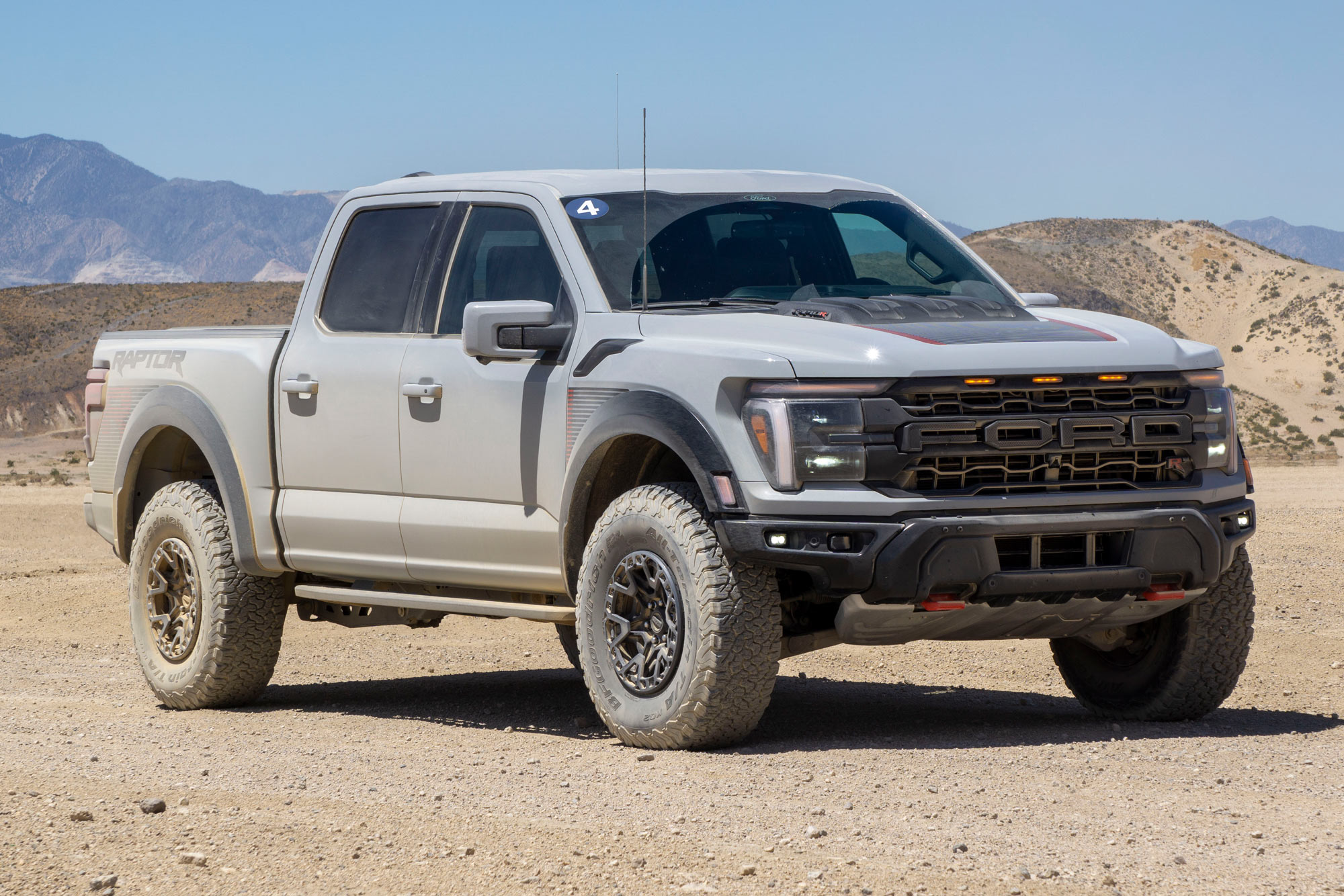 Front a light gray 2024 Ford F-150 Raptor R