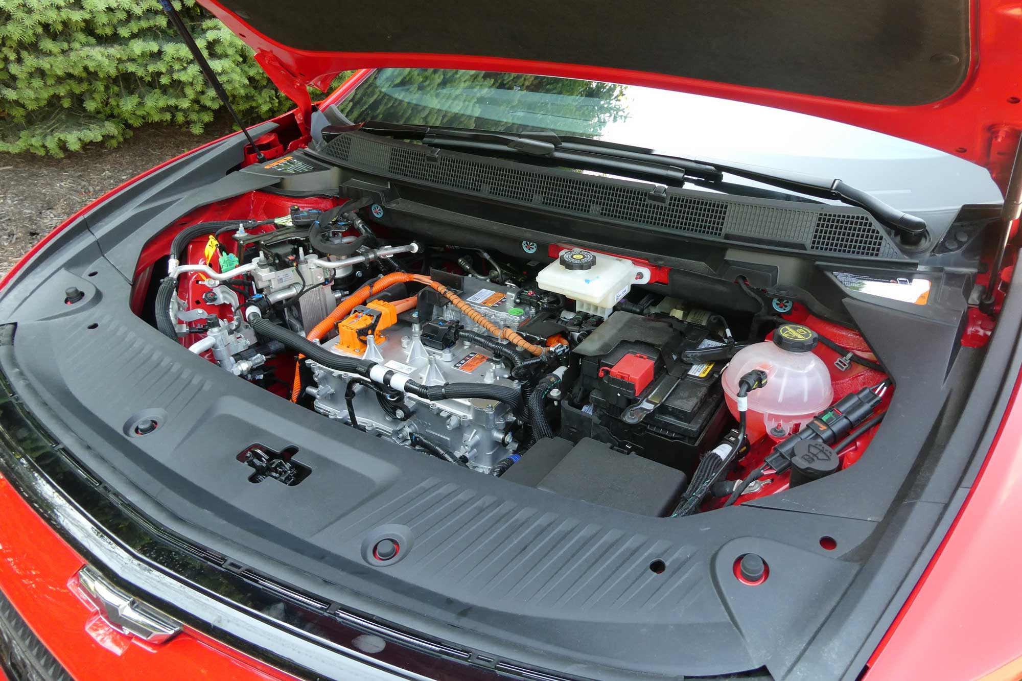 Under the hood of a red 2024 Chevrolet Equinox EV 3RS