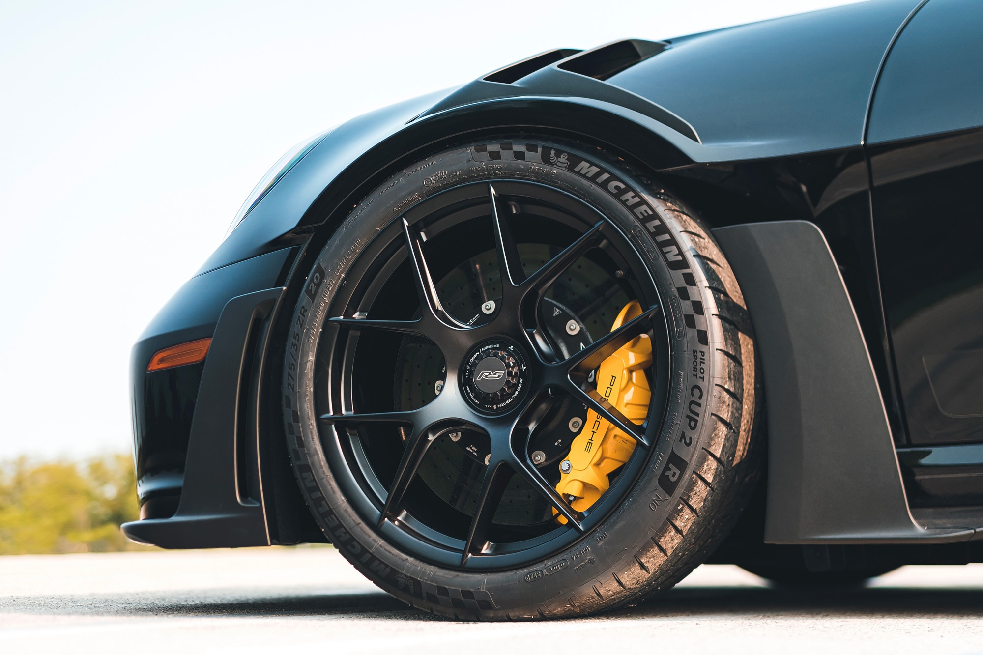 Close-up of center-lock wheel on Porsche 911 GT3 RS.