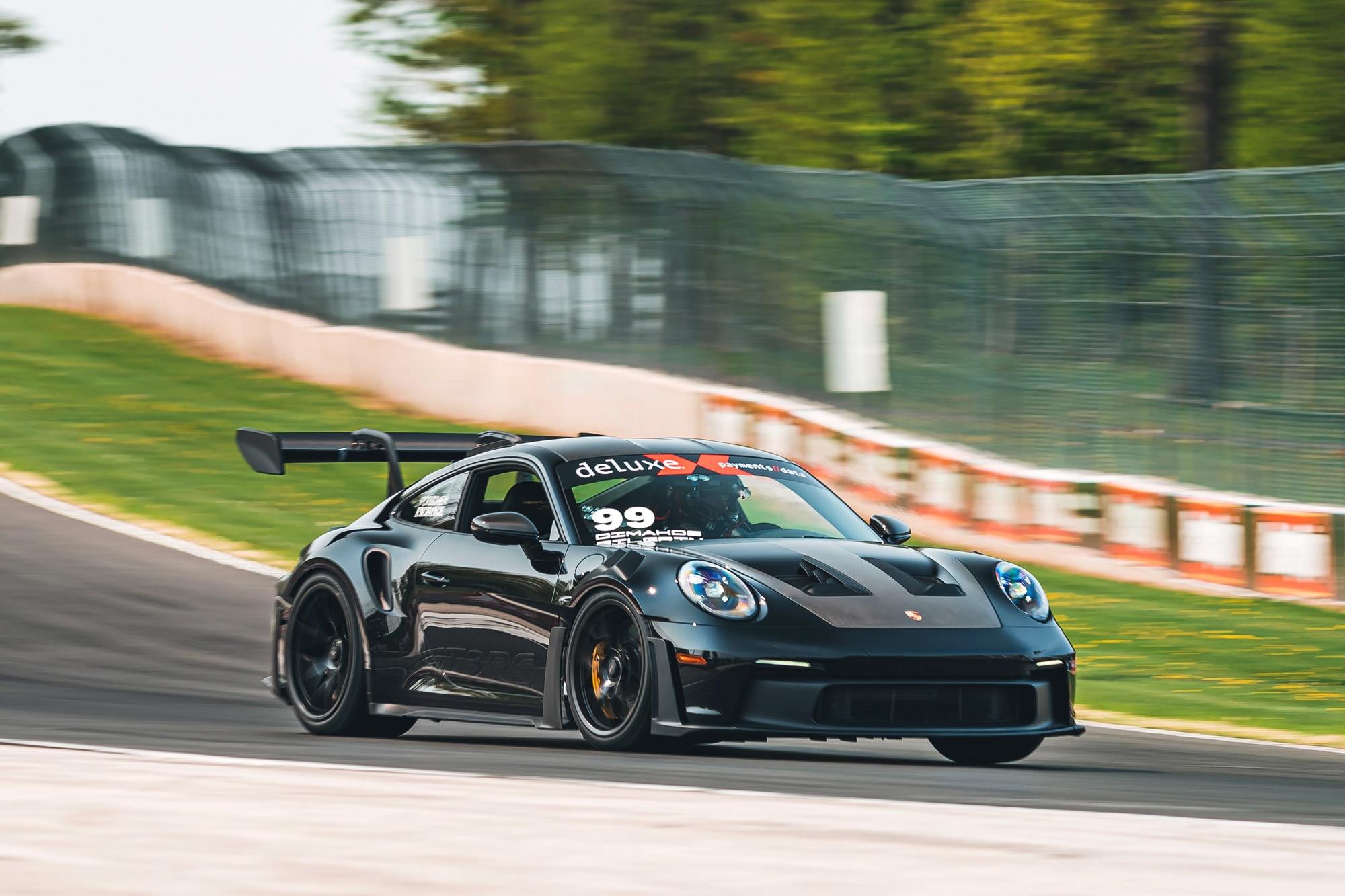 Porsche 911 on racetrack.