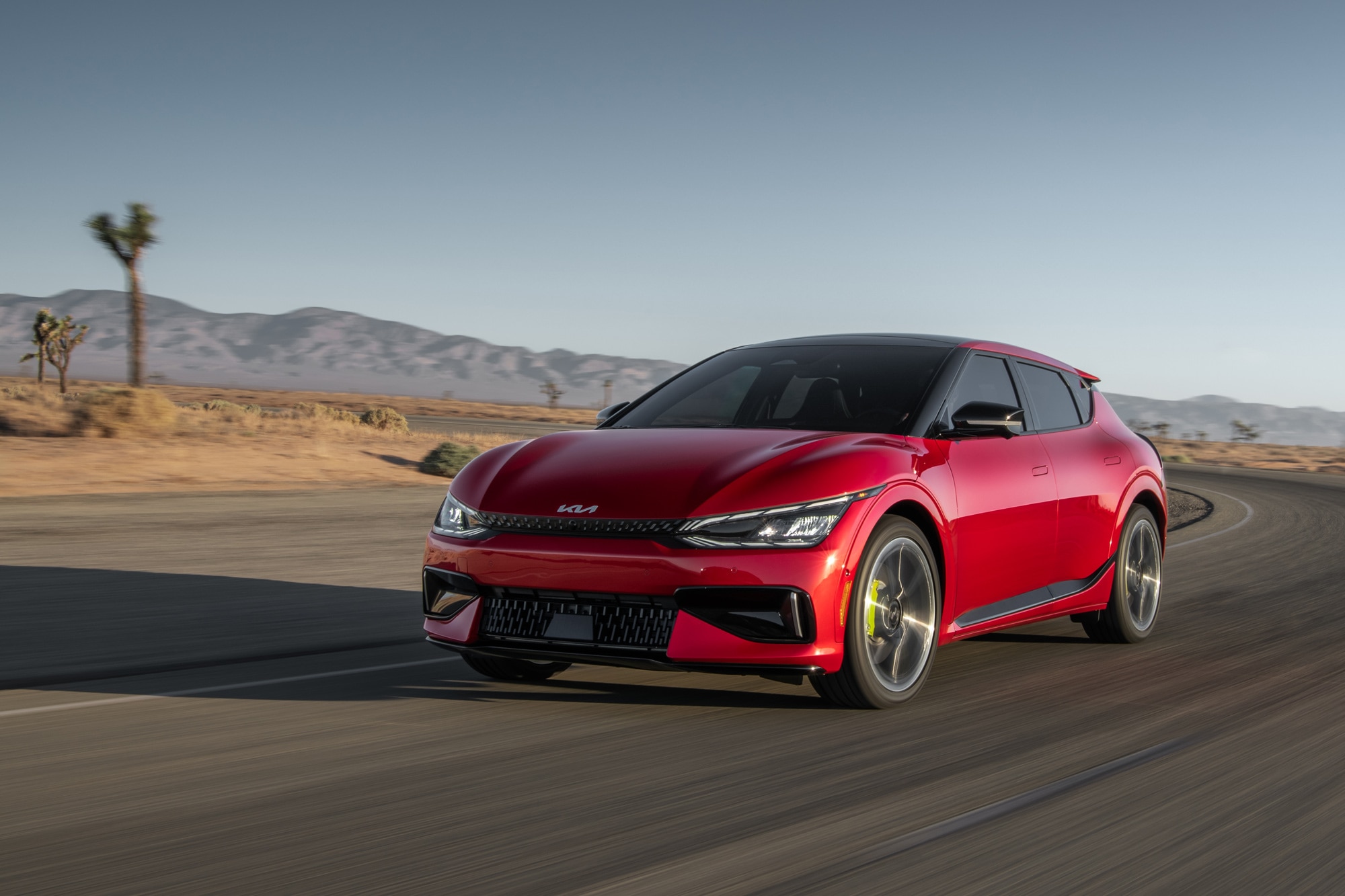 Red 2023 Kia EV6 GT on a desert highway