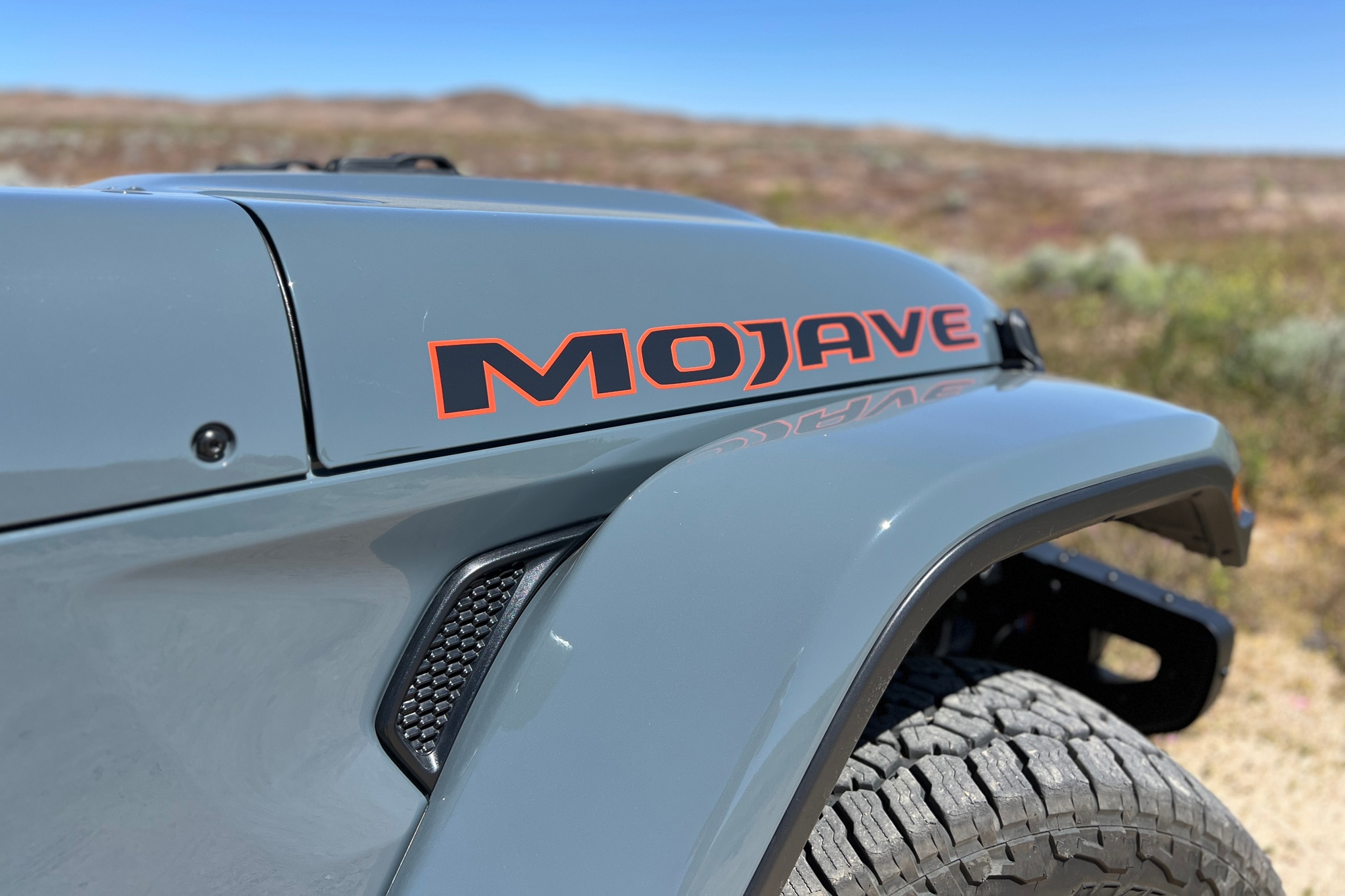 View of the 2024 Jeep Gladiator Mojave hood decal with the desert in the background.