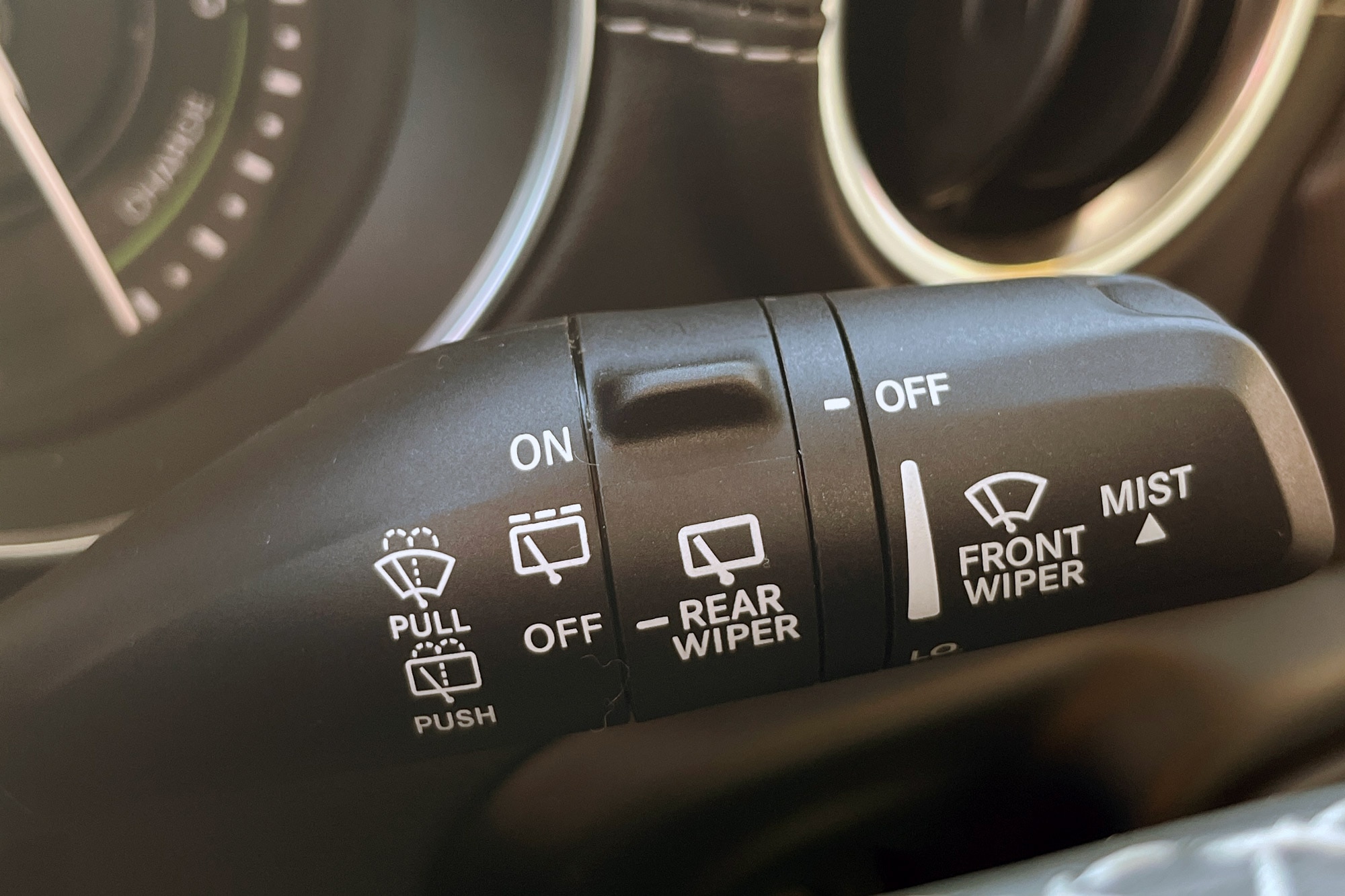 Windshield wiper buttons