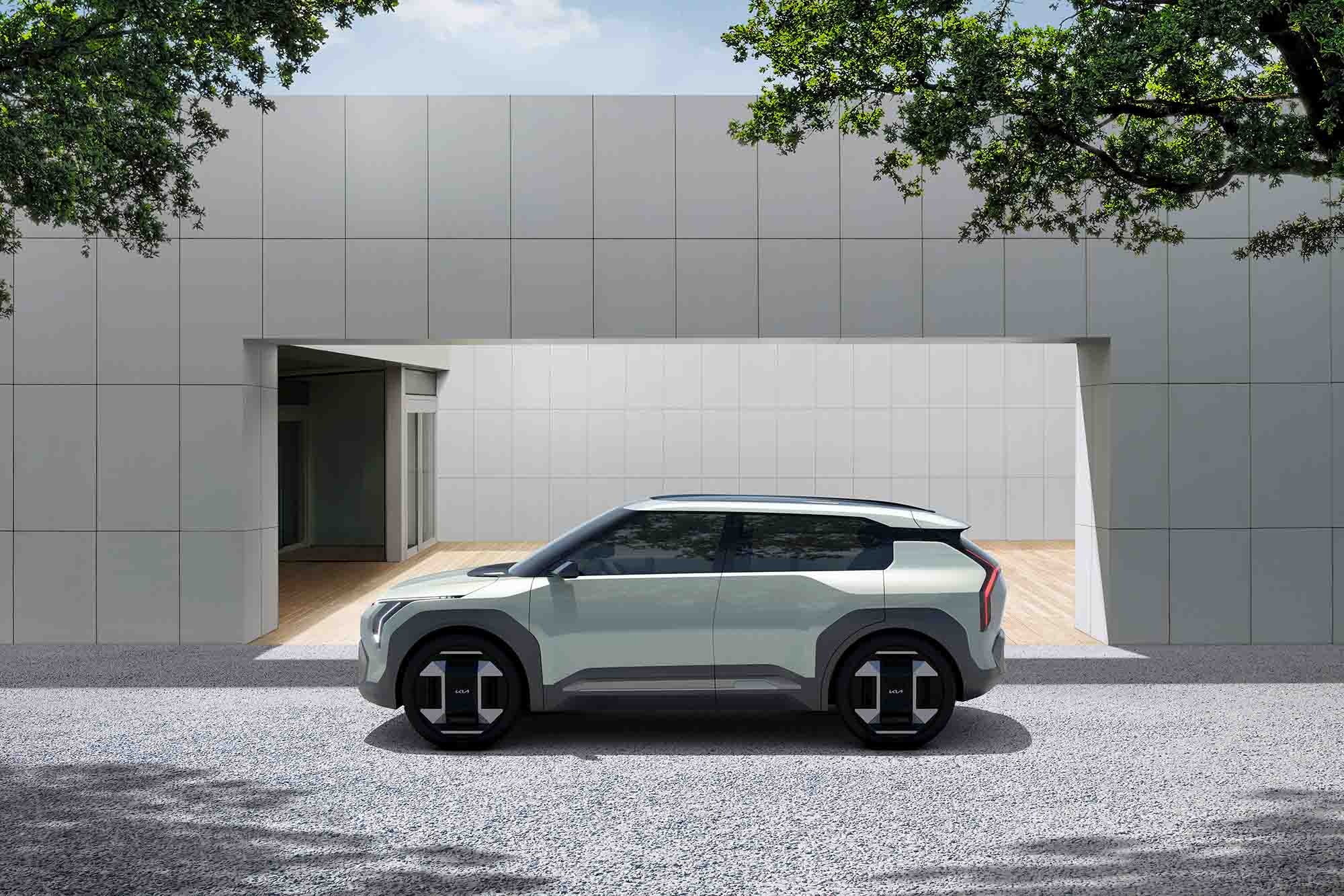 Kia EV3 concept car outside modern building.