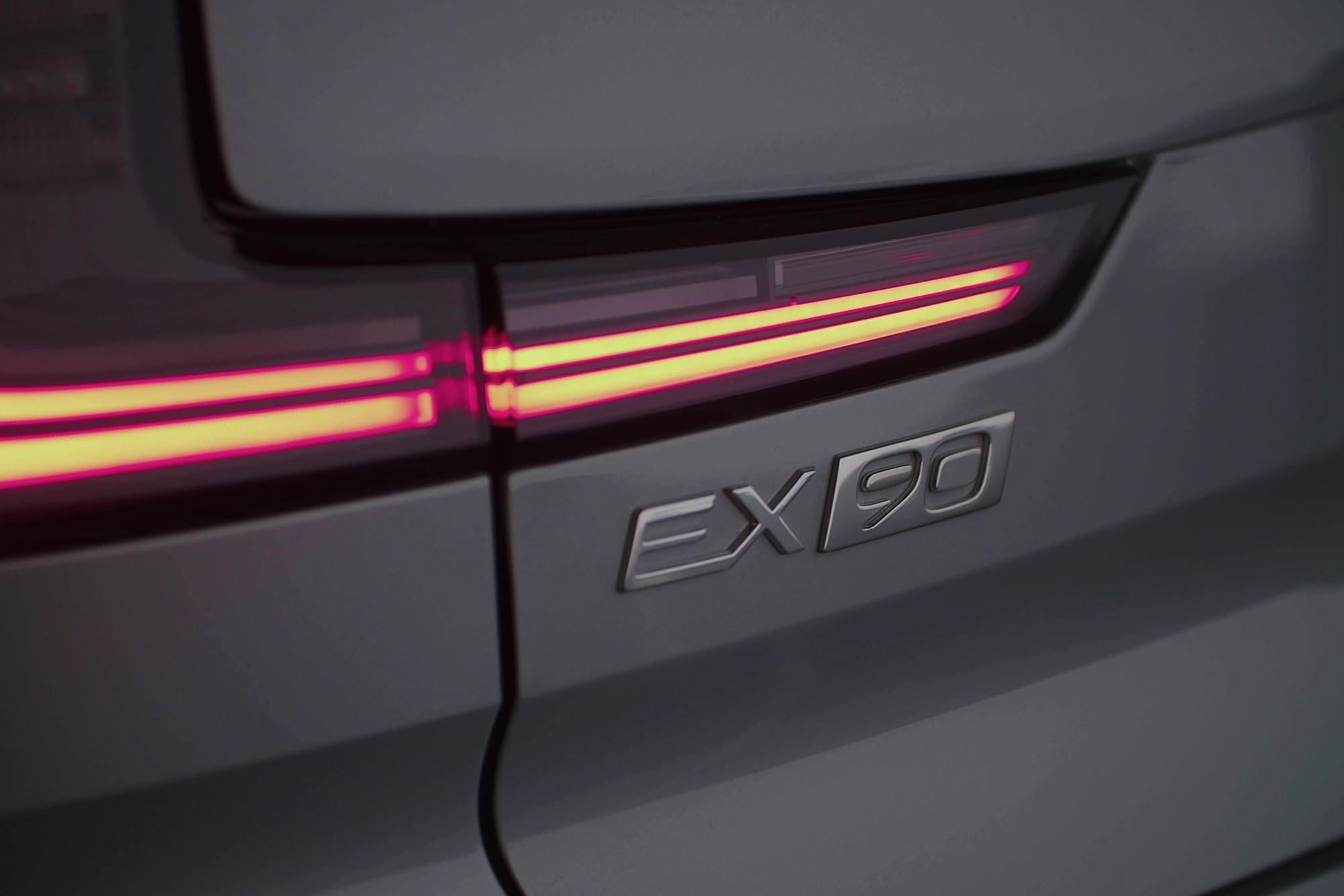 Close-up shot of the Volvo EX90 badge.