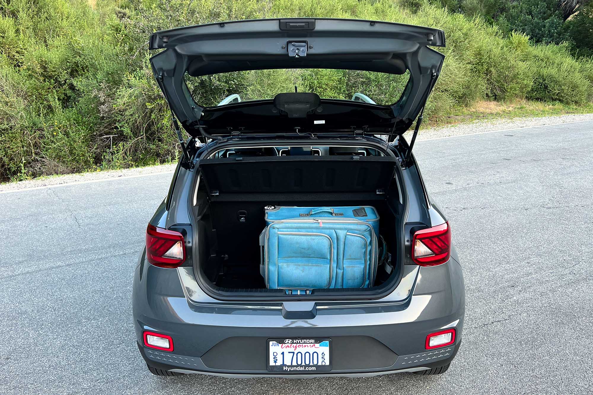 View of a 2024 Hyundai Venue Limited showing the cargo area with a full-size suitcase inside.
