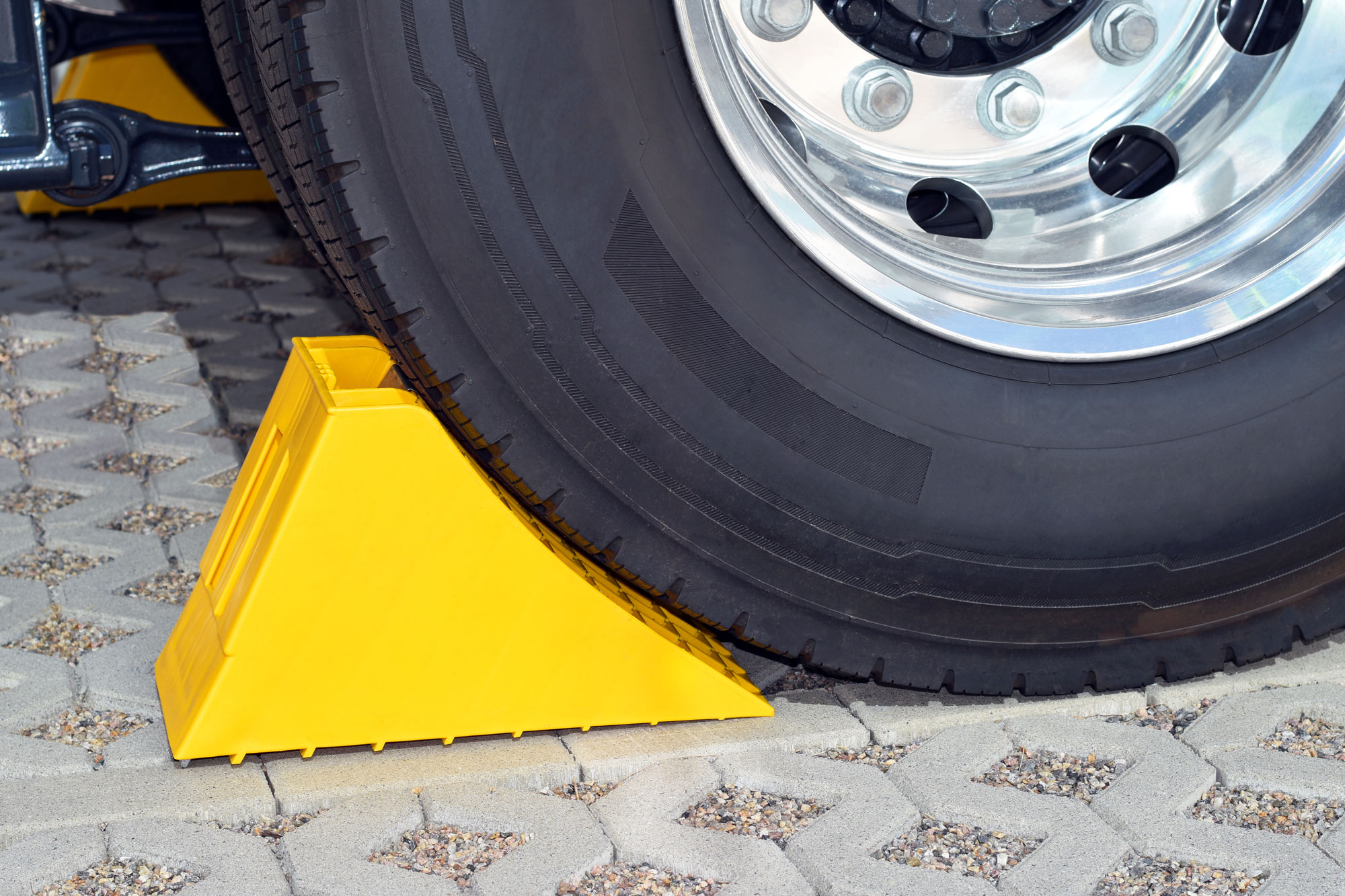 Wheel chock behind a tire