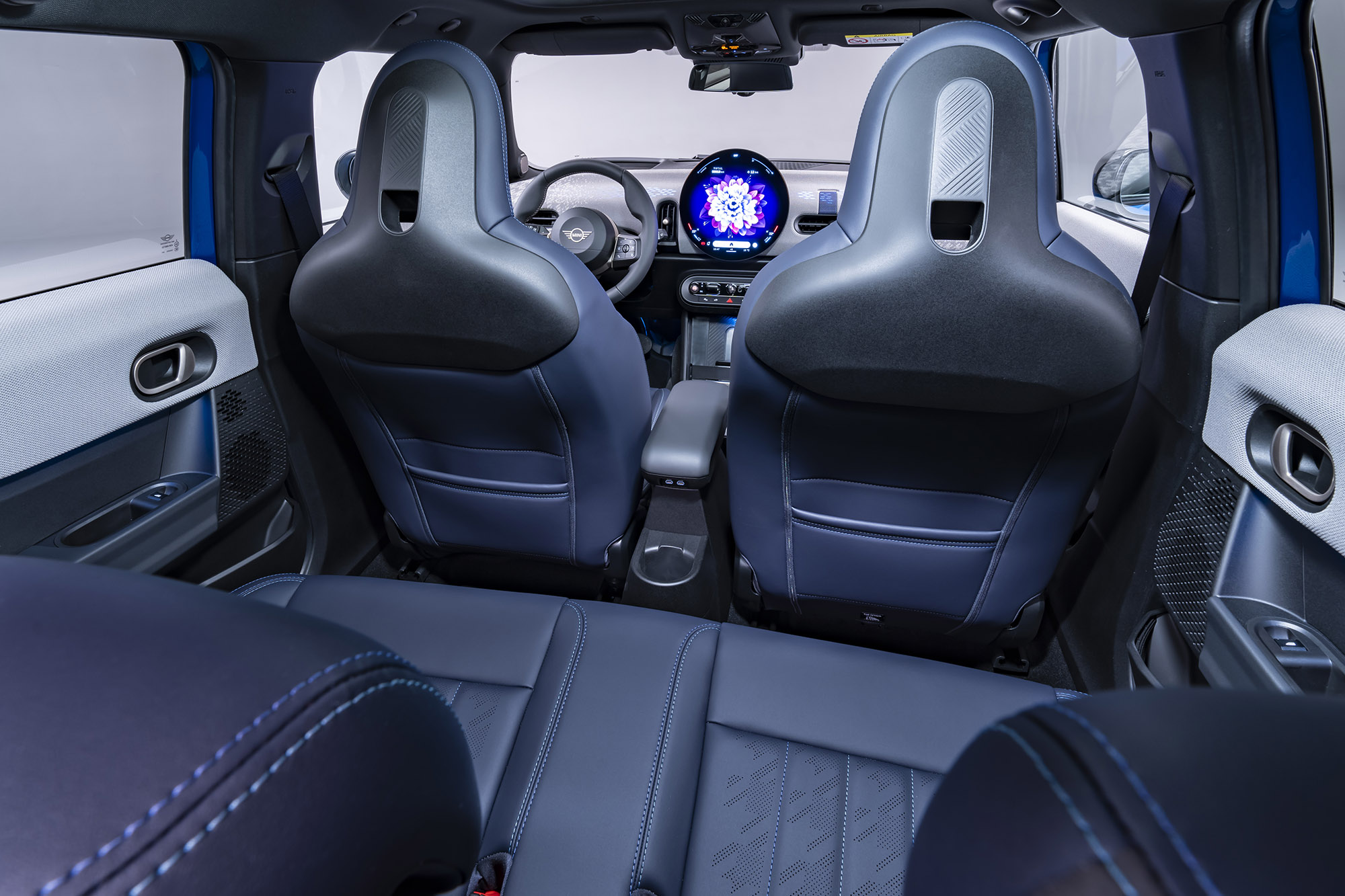 2025 Mini Cooper 4-Door interior in blue, rear cabin