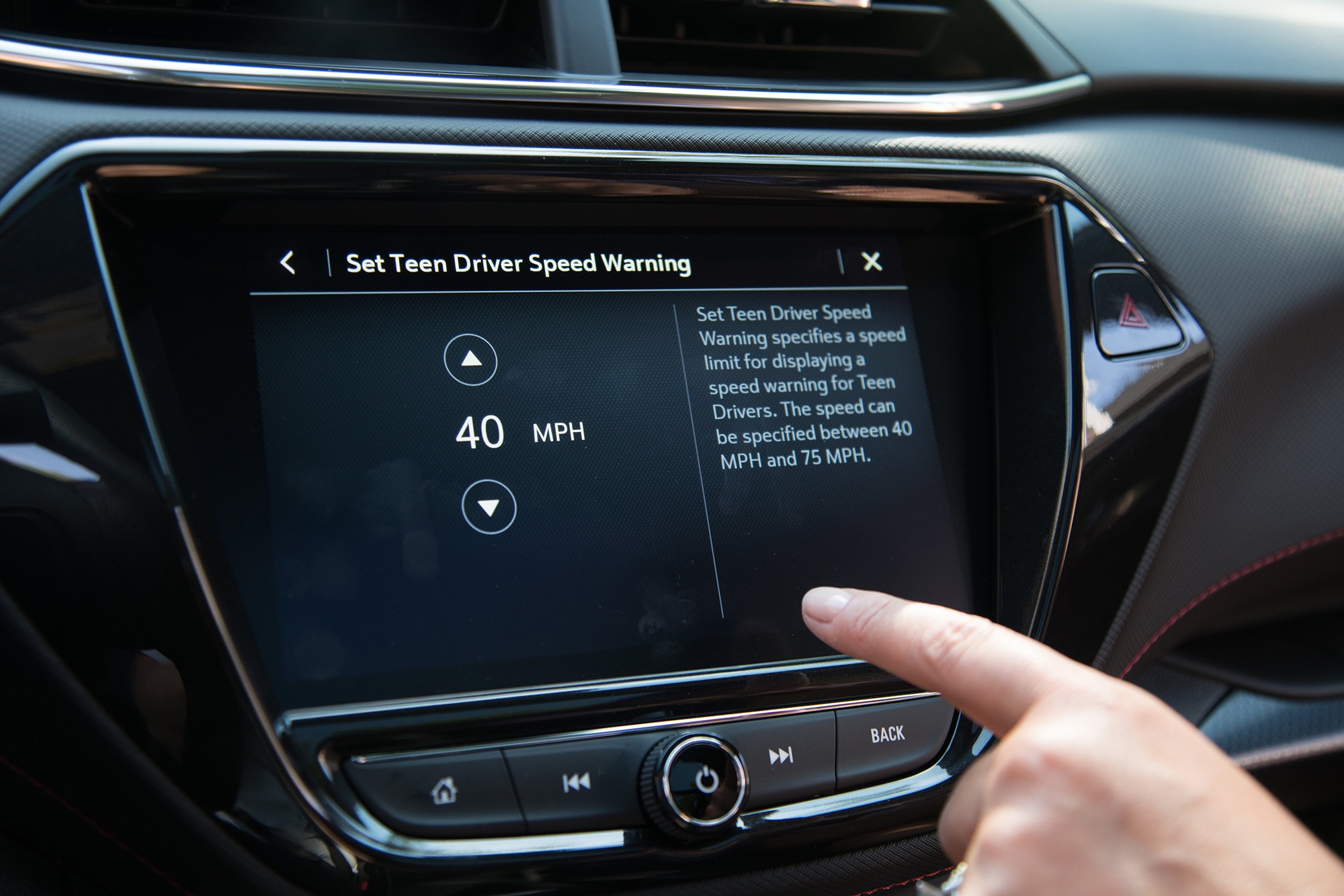 Infotainment screen with Set Teen Driver Speed Warning displayed.