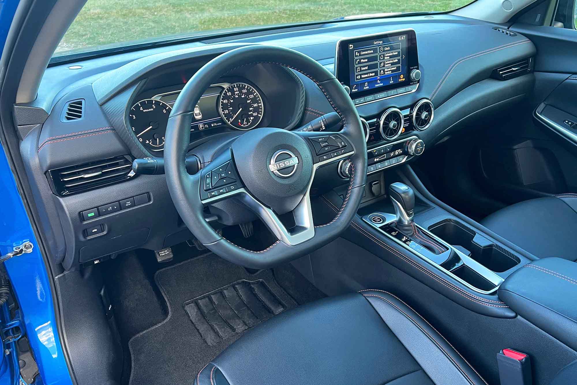 View of a 2024 Nissan Sentra interior showing the dashboard and front seats.