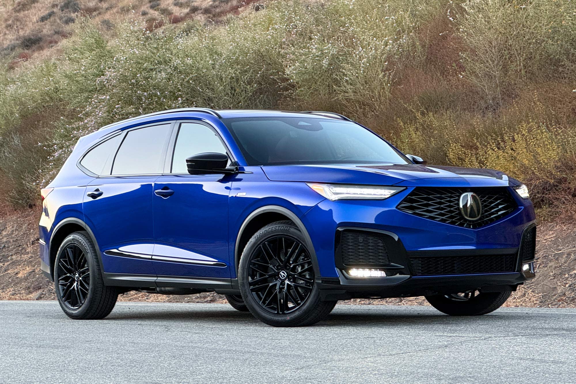 Front of an Apex Blue 2025 Acura MDX A-Spec Advance