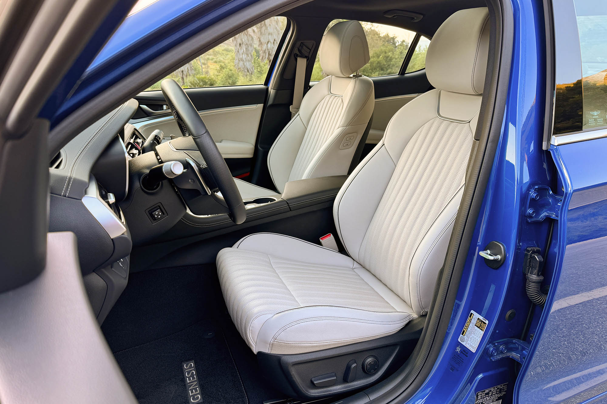 View of a 2024 Genesis G70 2.5T Sport Prestige interior showing the front seats