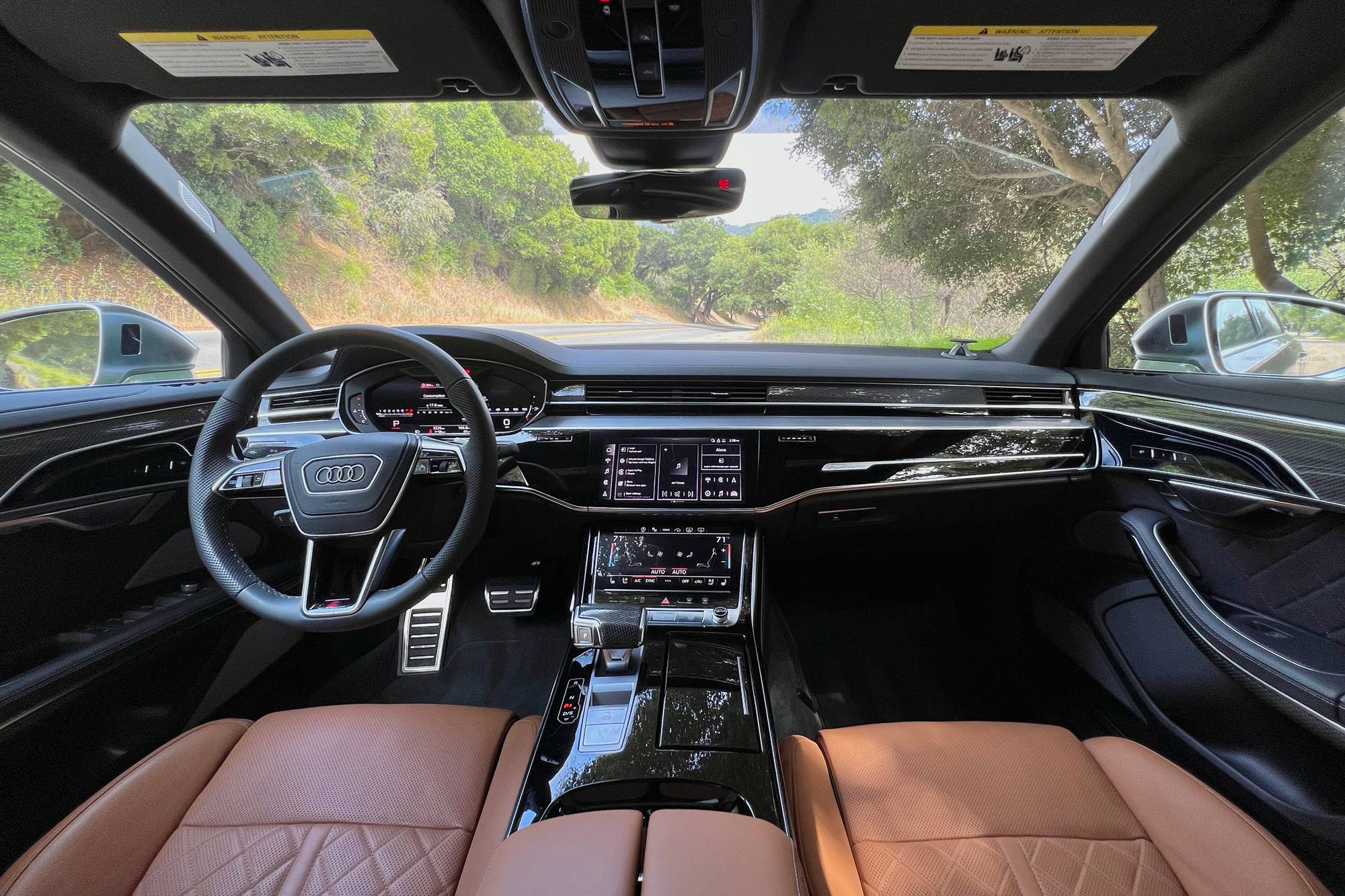 2024 Audi S8 interior showing the dashboard and front seats.