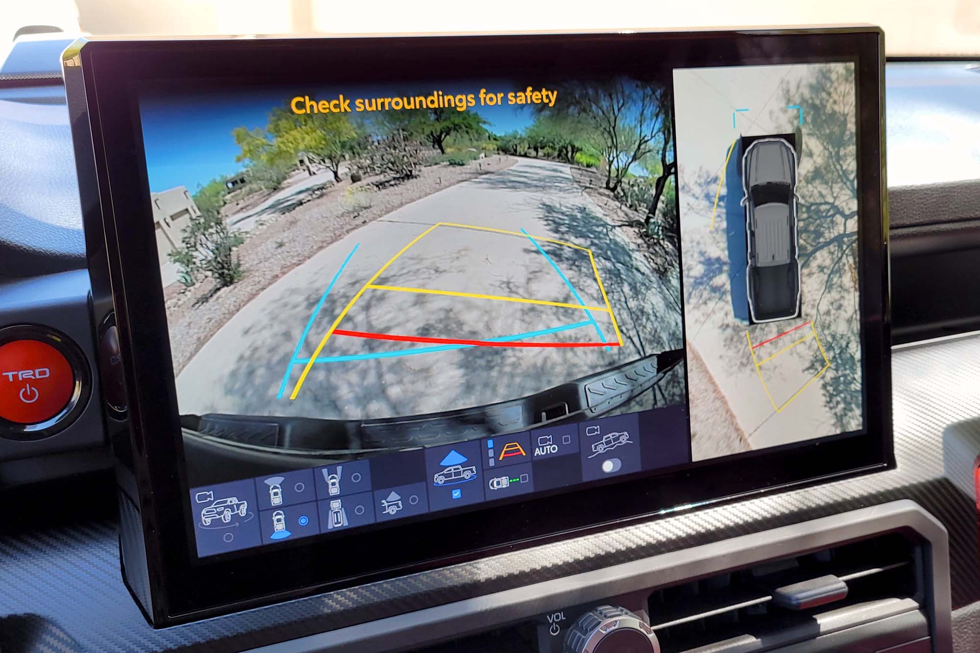 View of a 2024 Toyota Tacoma TRD Pro interior showing the reversing and top-down surround-view camera systems.