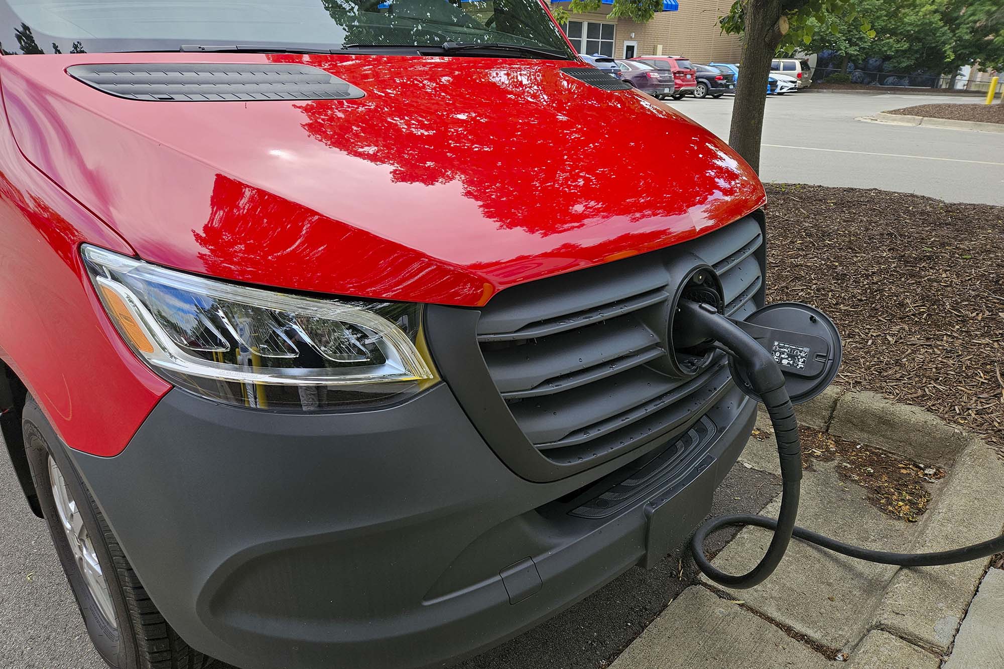 A 2024 Mercedes-Benz eSprinter plugged in and recharging the battery pack