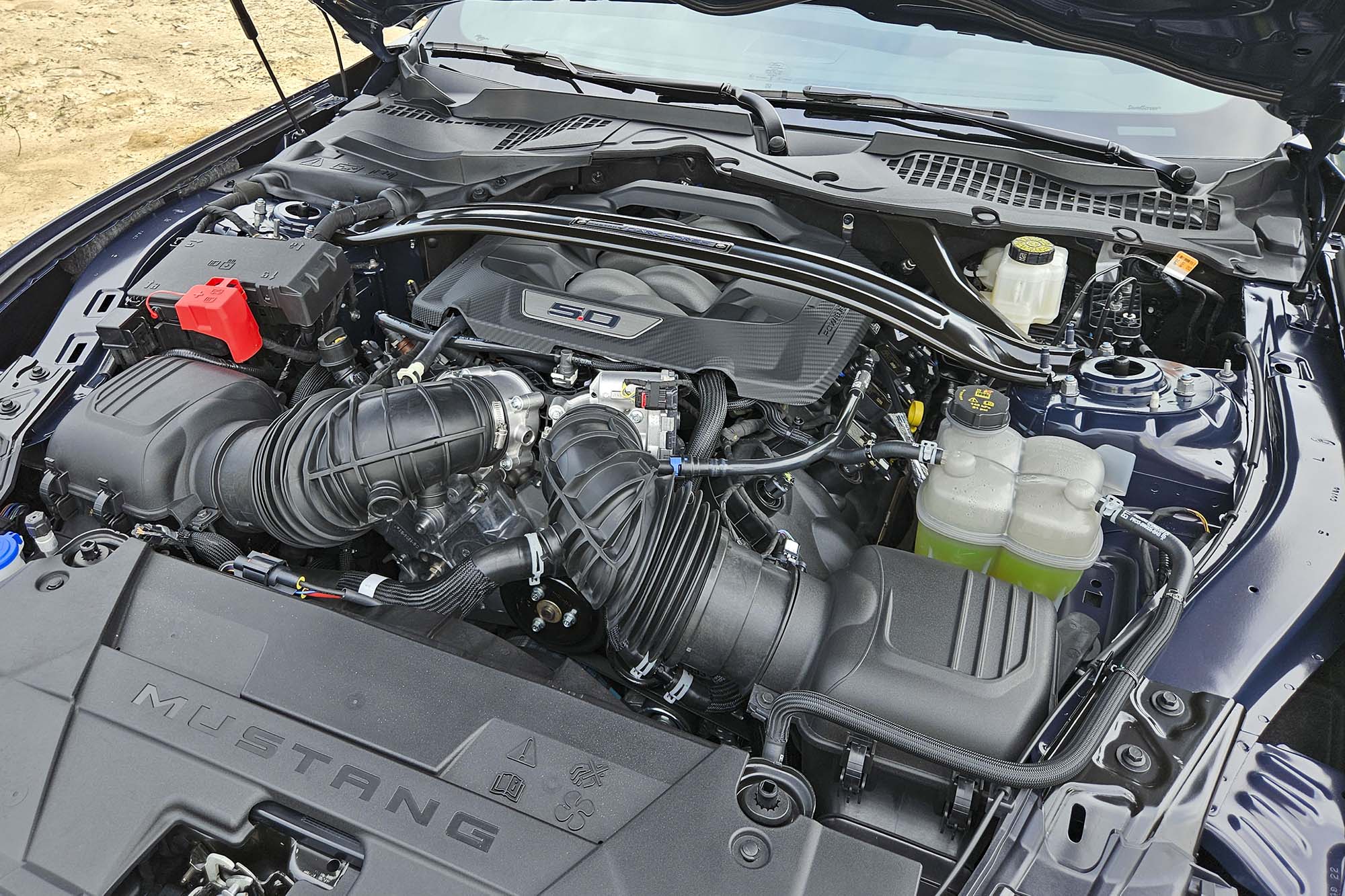 View of a 2024 Ford Mustang Dark Horse engine, a 5.0-liter Coyote V8 making 500 horsepower.