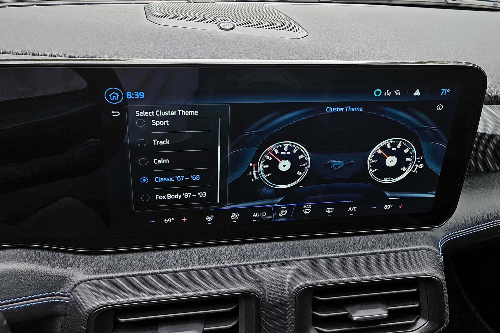 View of a 2024 Ford Mustang Dark Horse interior showing the infotainment screen and the menu for changing the gauges to a classic theme.