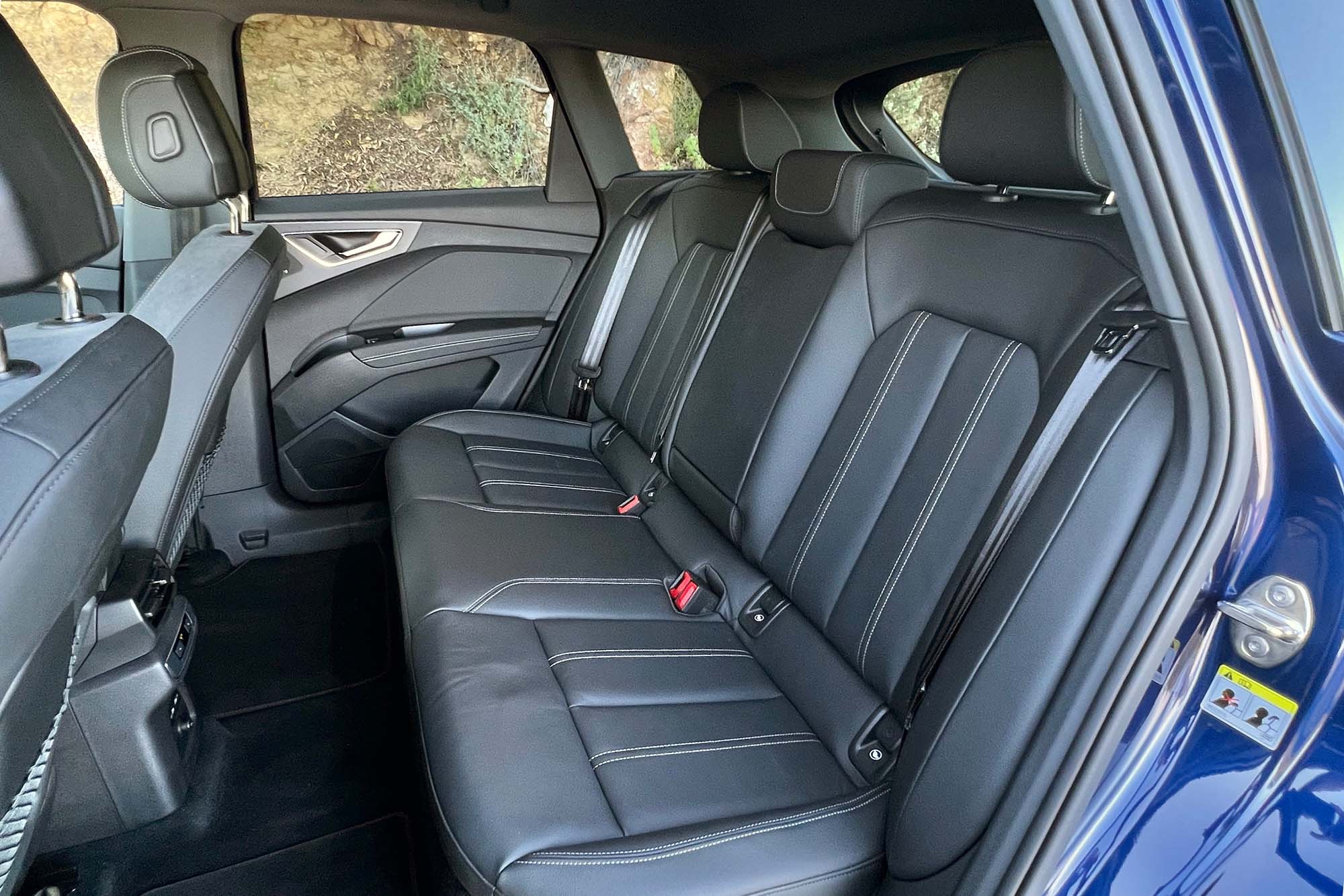 View of a 2024 Audi Q4 55 e-tron interior showing the back seat.