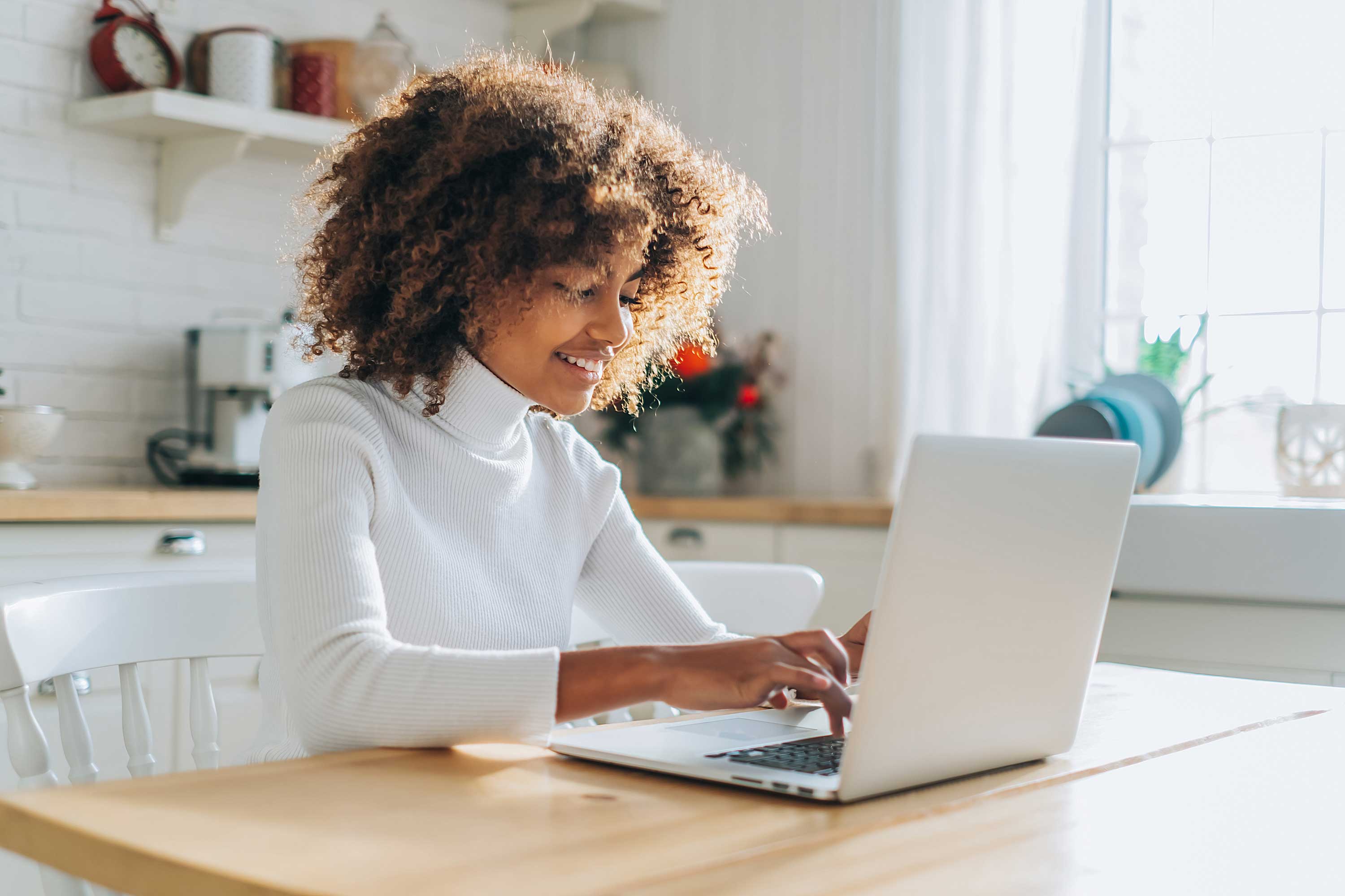 Person looking at open laptop