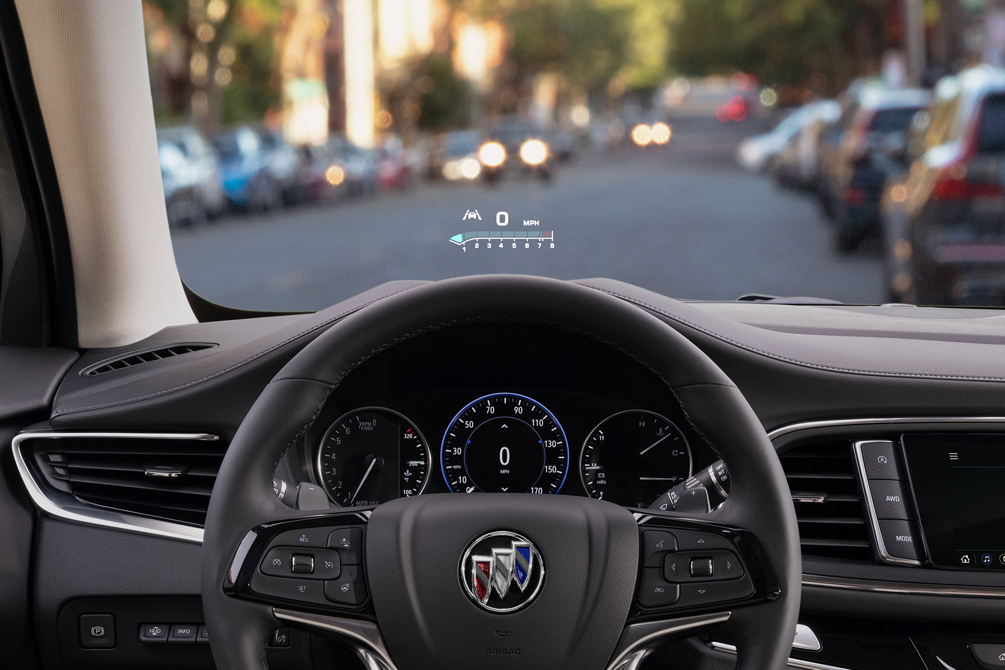 Steering wheel and head-up display in a Buick Enclave.