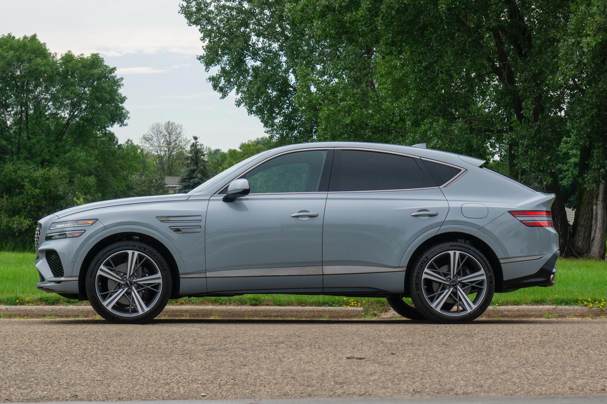 Side of a Bering Blue 2025 Genesis GV80 Coupe