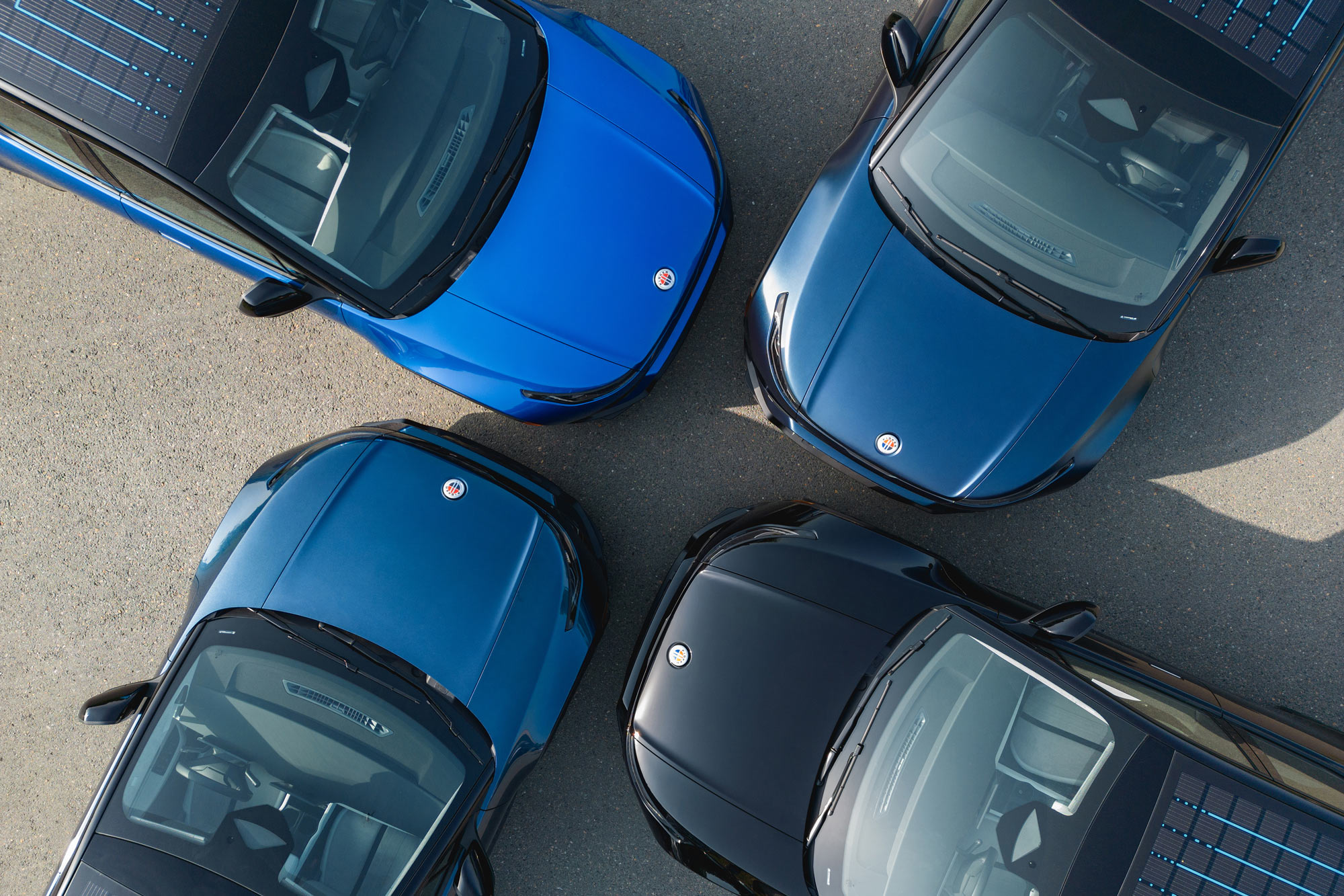 Top view of four Fisker Ocean SUVs parked facing each other