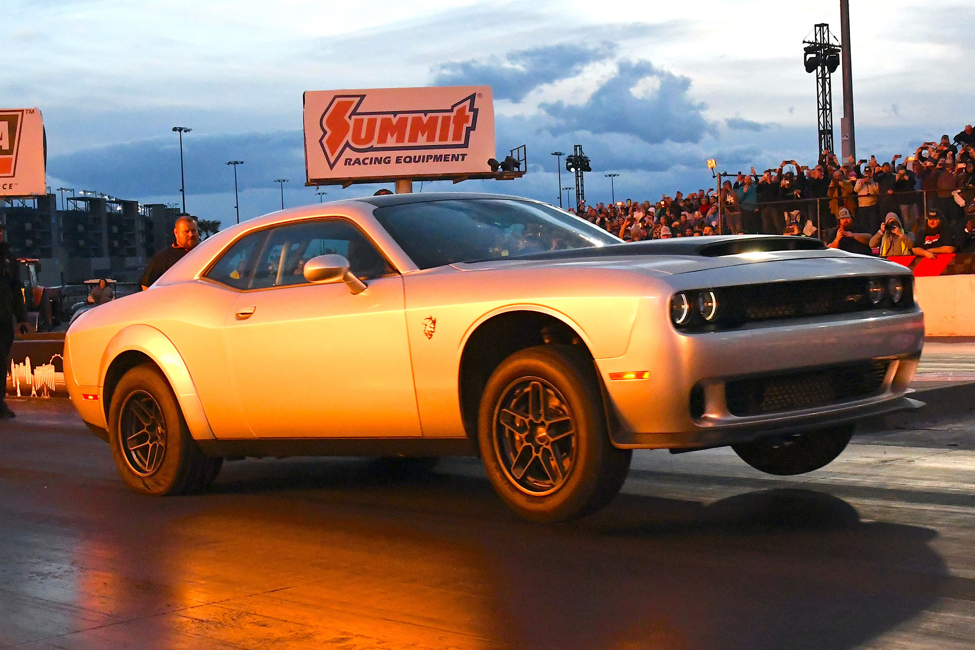 A 2023 Dodge Challenger SRT Demon 170 lifts its front wheels during a dragstrip run