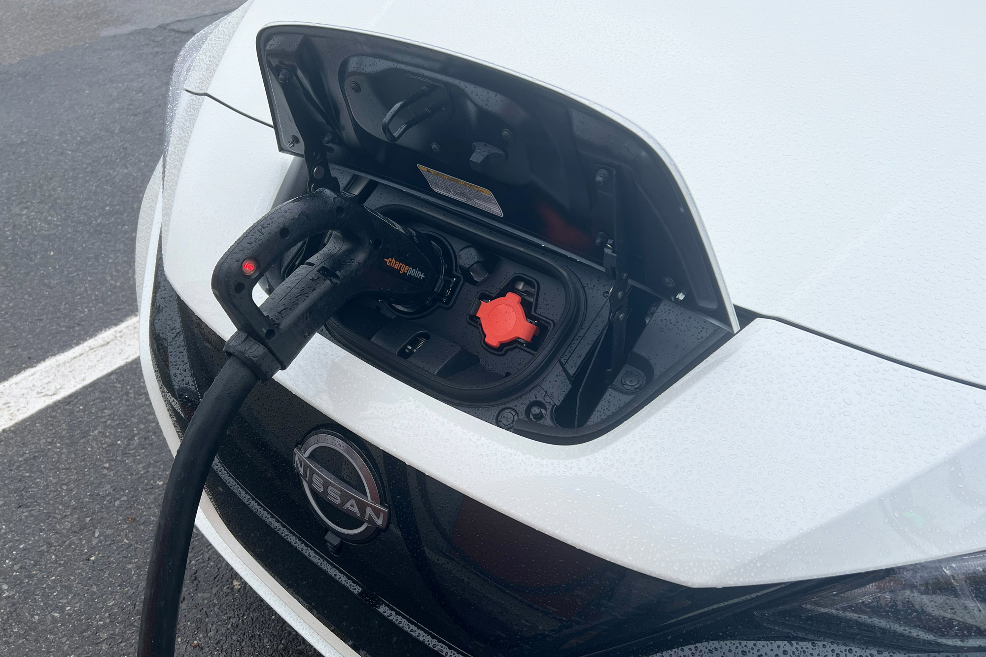 2024 Nissan Leaf SV Plus charging port while the car is plugged in and recharging