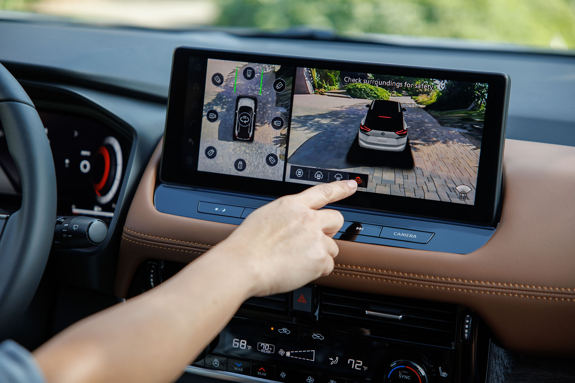 Nissan Rogue infotainment screen with person's finger pointing to a setting.