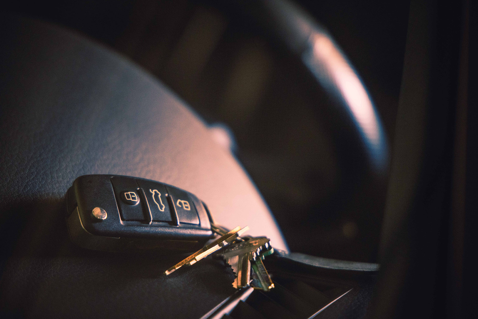 Key fob on the dashboard of a car.