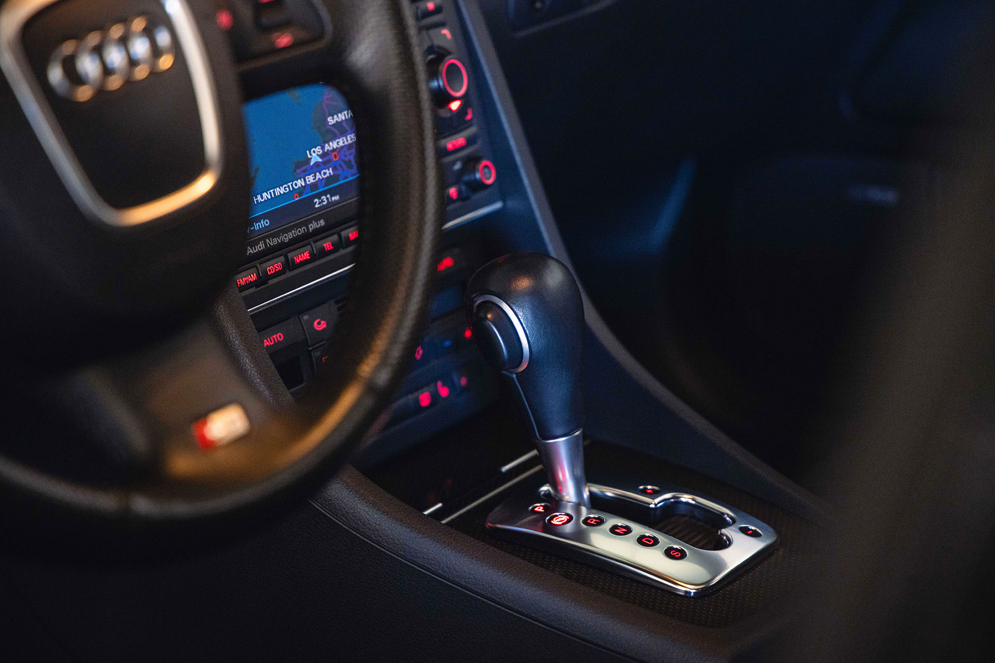 An automatic transmission gear shift in the park position.